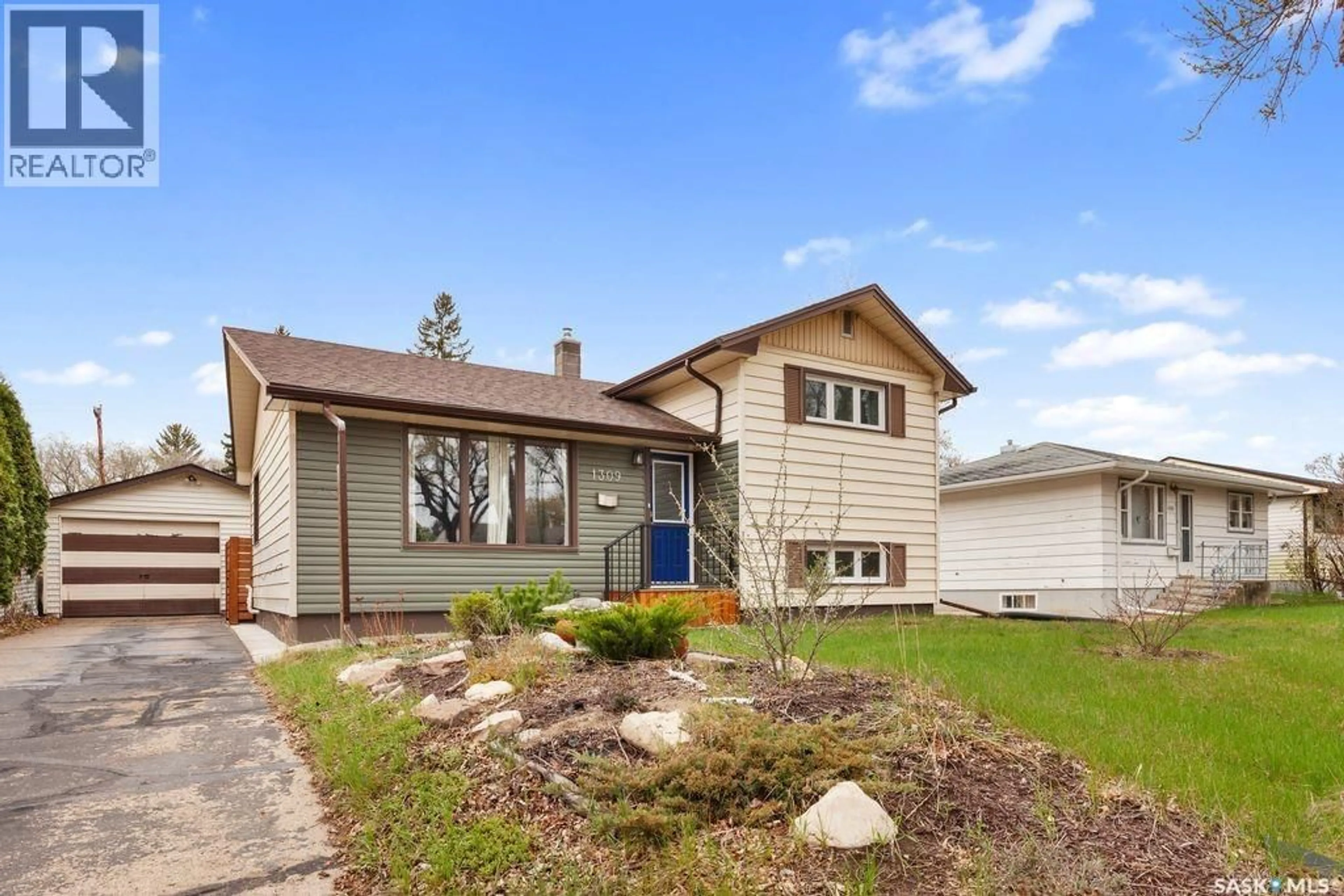 Home with vinyl exterior material, street for 1309 N AVENUE S, Saskatoon Saskatchewan S7M2R2