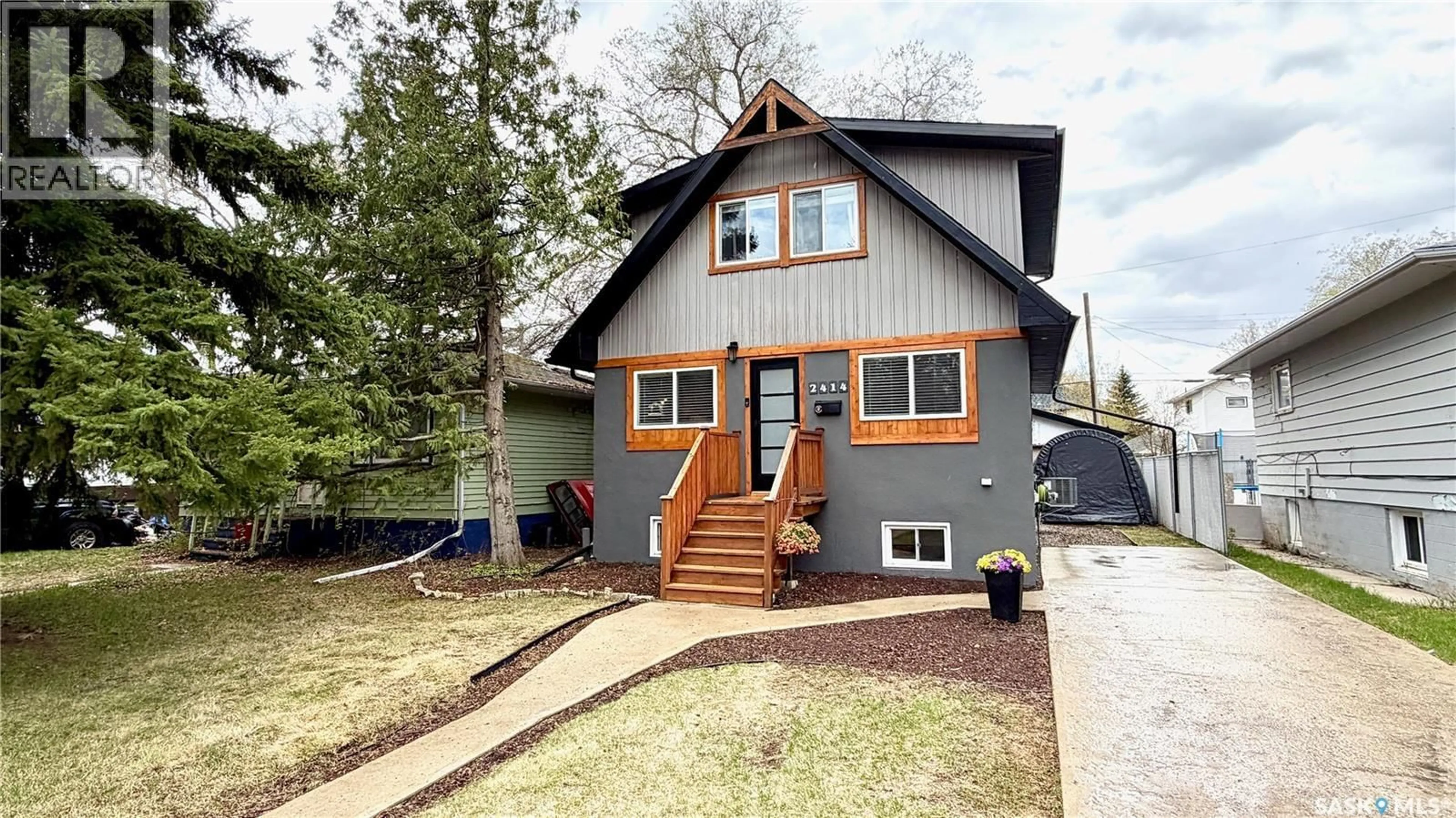 Home with vinyl exterior material, street for 2414 MELROSE AVENUE, Saskatoon Saskatchewan S7J0V5