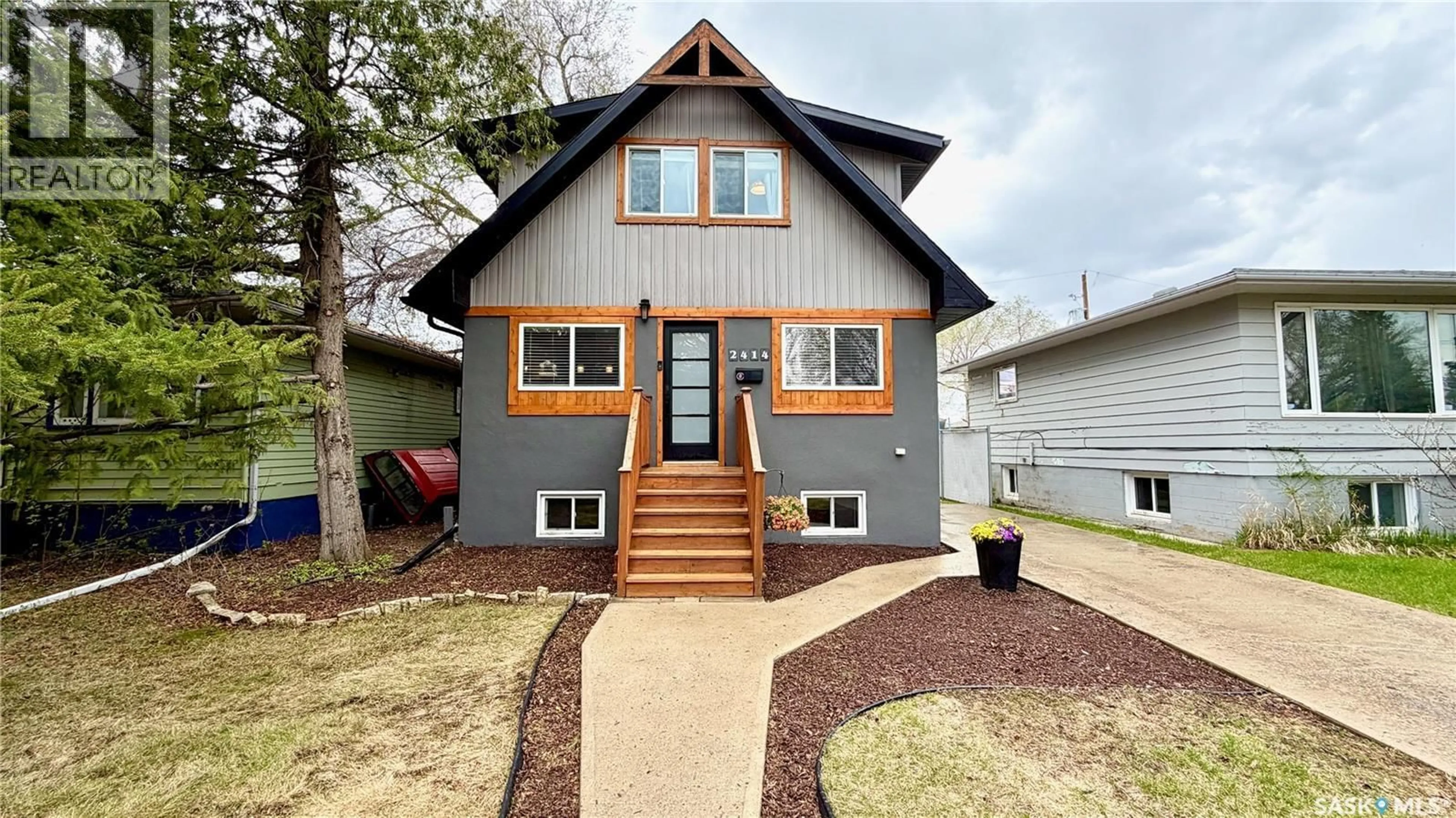 Home with vinyl exterior material, street for 2414 MELROSE AVENUE, Saskatoon Saskatchewan S7J0V5