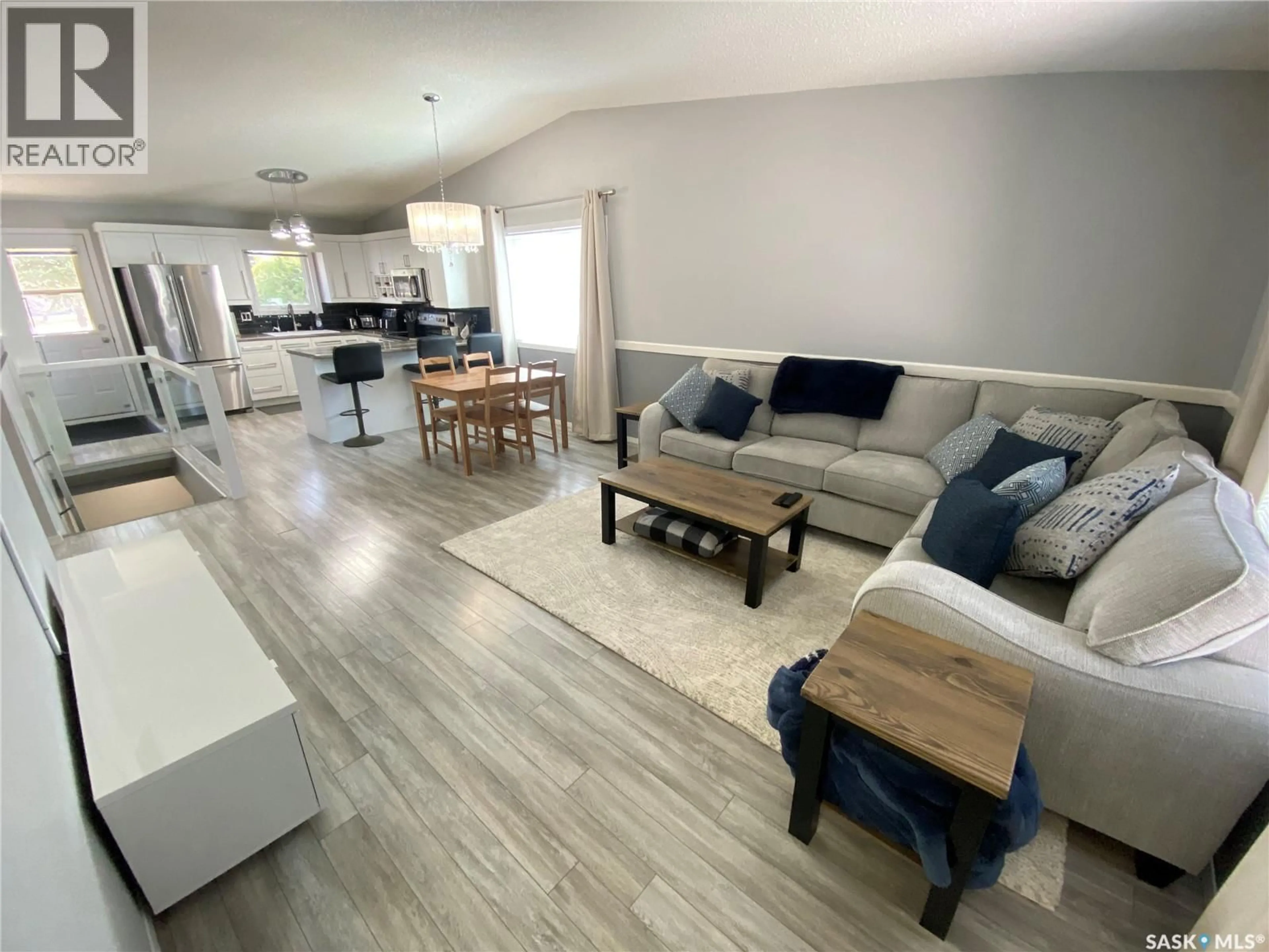 Living room with furniture, wood/laminate floor for 68 FENSON CRESCENT, Yorkton Saskatchewan S3N3S5