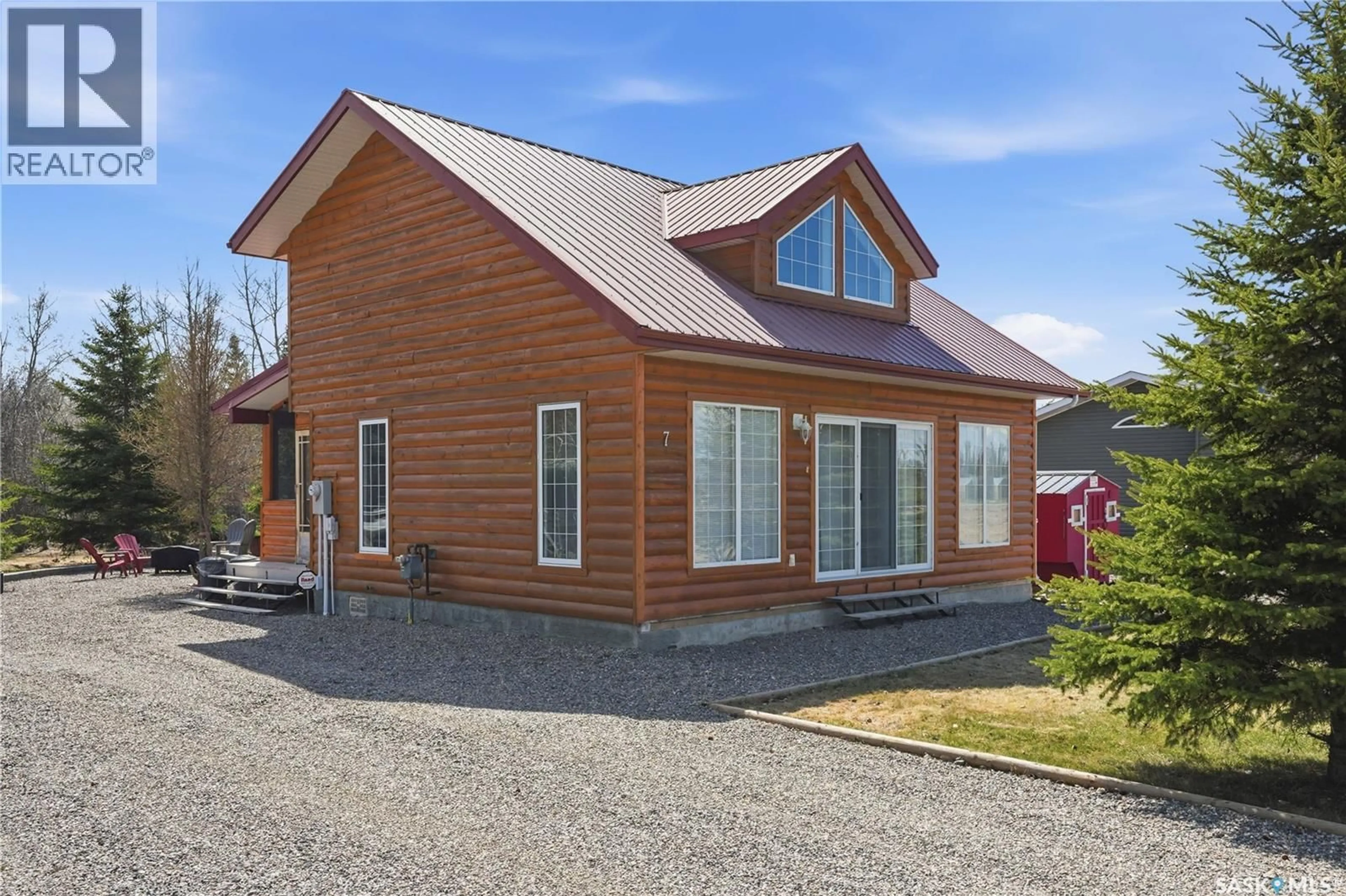 Home with vinyl exterior material, street for 7 PINE DRIVE, Candle Lake Saskatchewan S0J3E0
