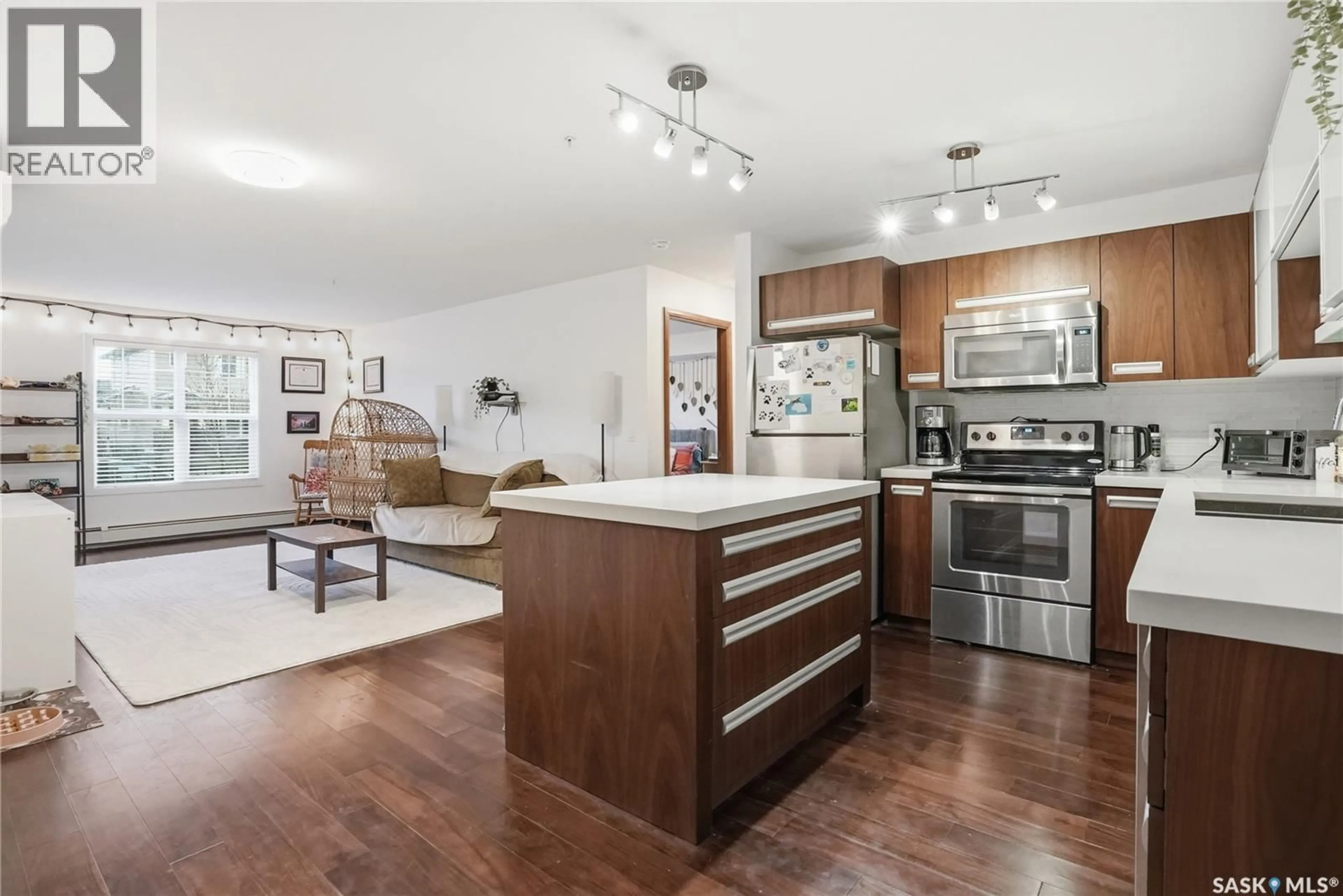 Open concept kitchen, wood/laminate floor for 130 - 107 PHELPS WAY, Saskatoon Saskatchewan S7V0K5