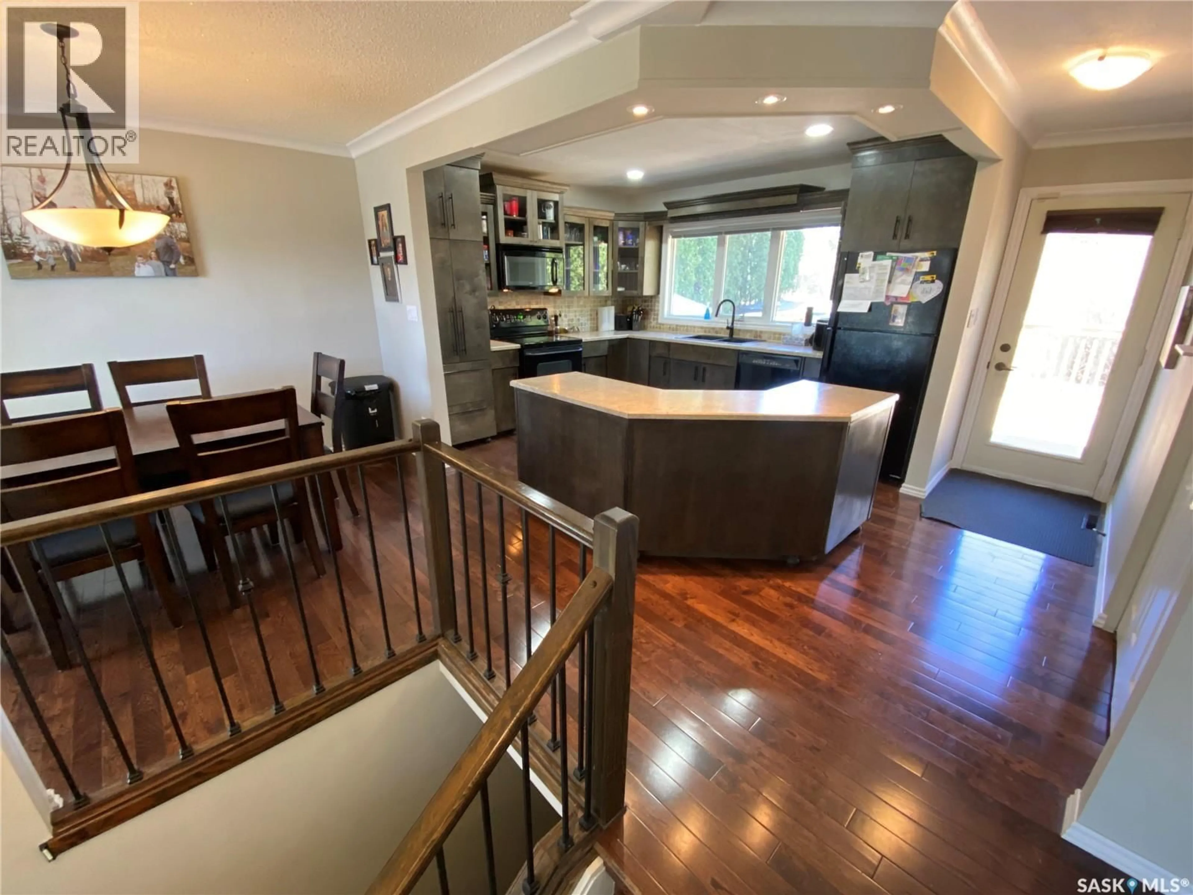 Open concept kitchen, wood/laminate floor for 36 MOSSFIELD PLACE, Yorkton Saskatchewan S3N2R2