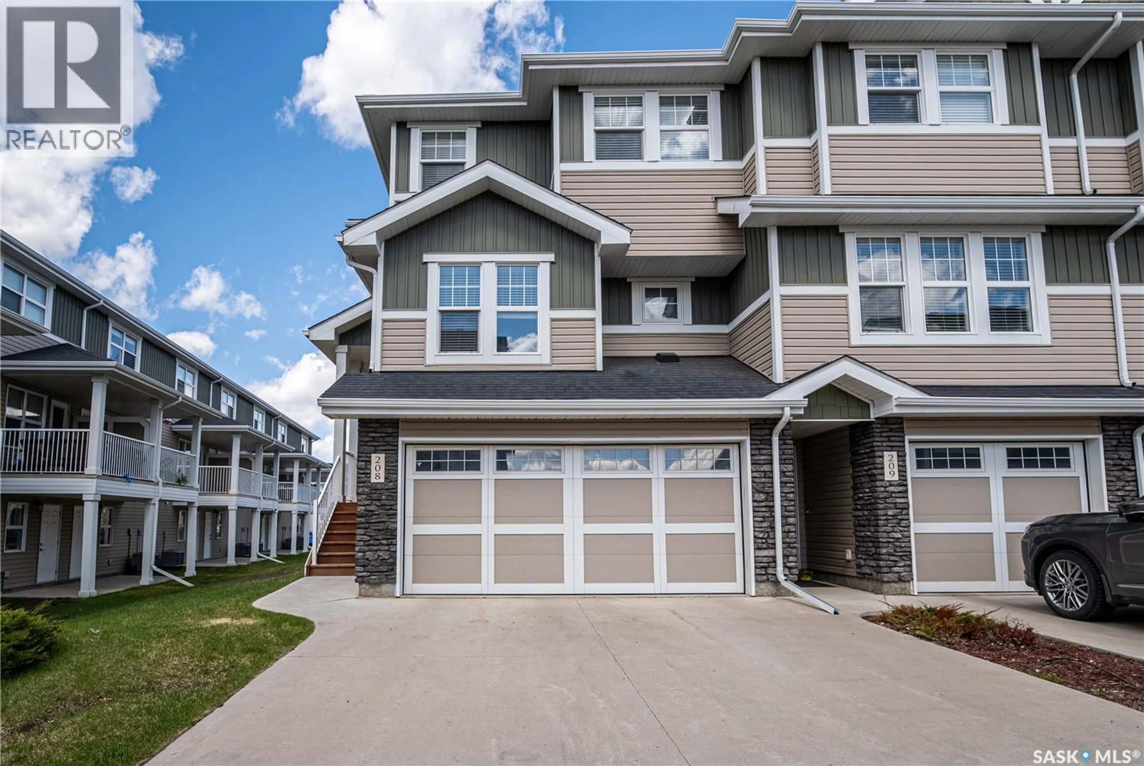 Home with vinyl exterior material, street for 208 - 1220 PRINGLE WAY, Saskatoon Saskatchewan S7T0X5