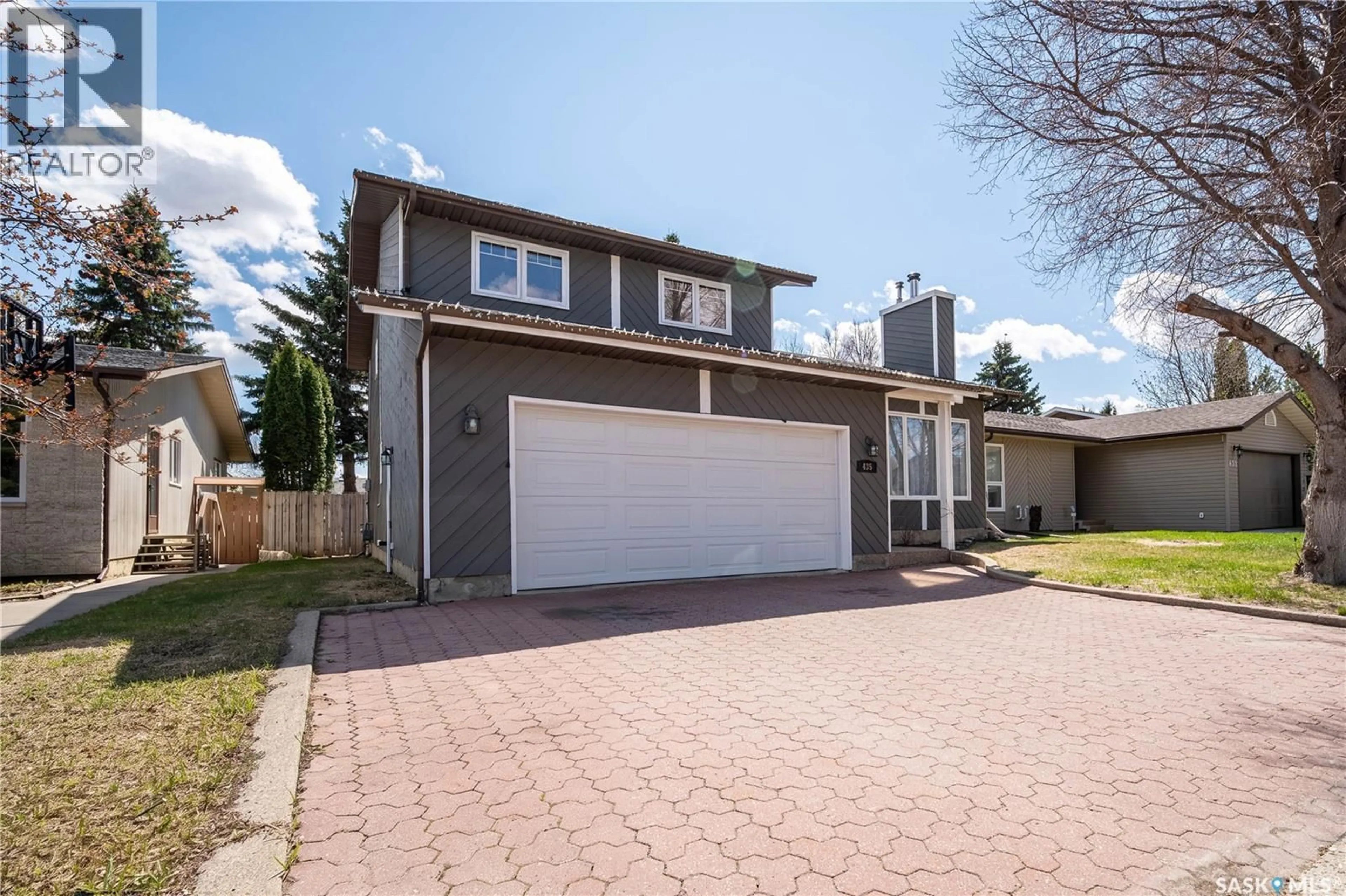 Home with vinyl exterior material, street for 435 CHRISTOPHER ROAD, Saskatoon Saskatchewan S7J3S1