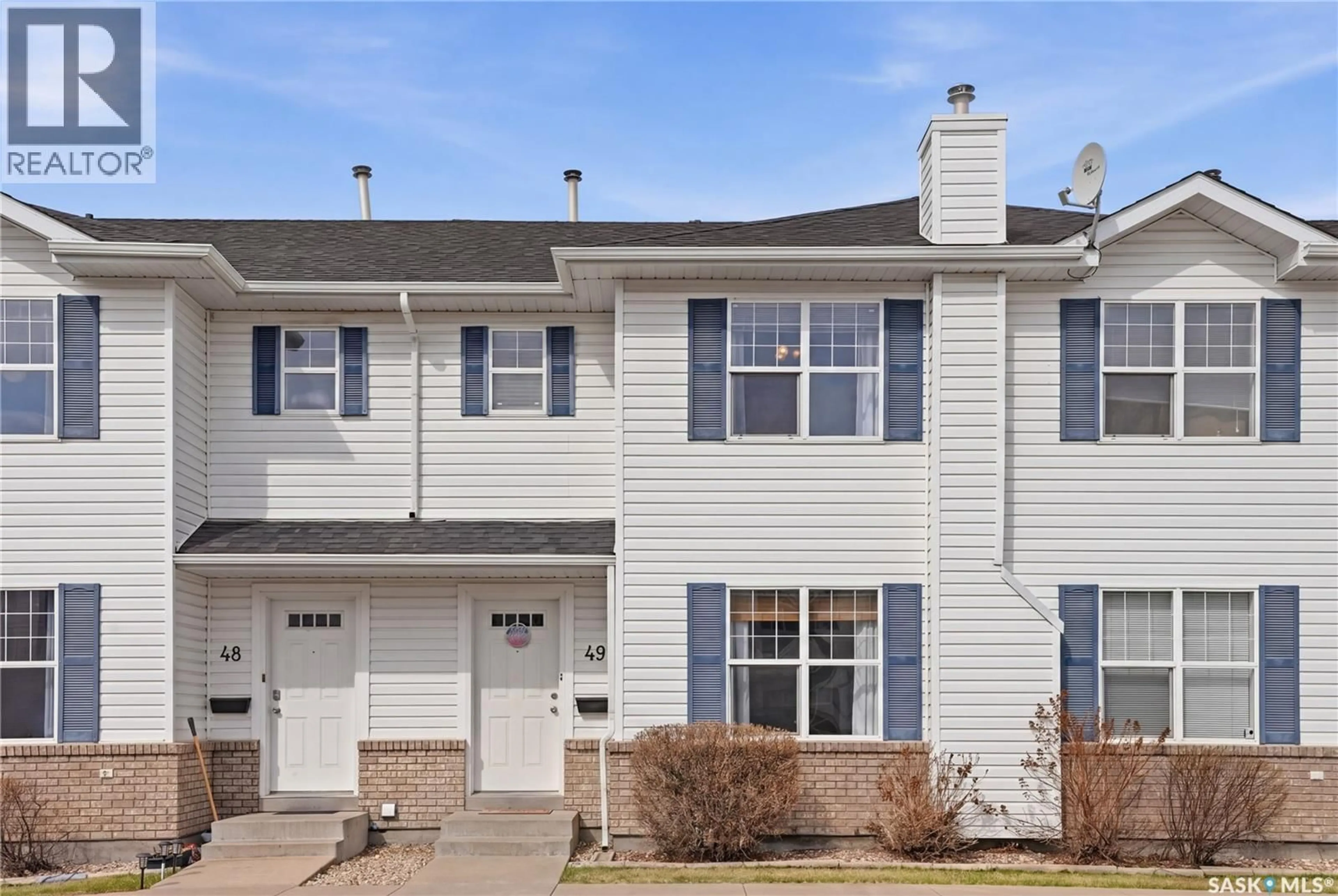 Home with vinyl exterior material, street for 49 203 HEROLD TERRACE, Saskatoon Saskatchewan S7V1H3