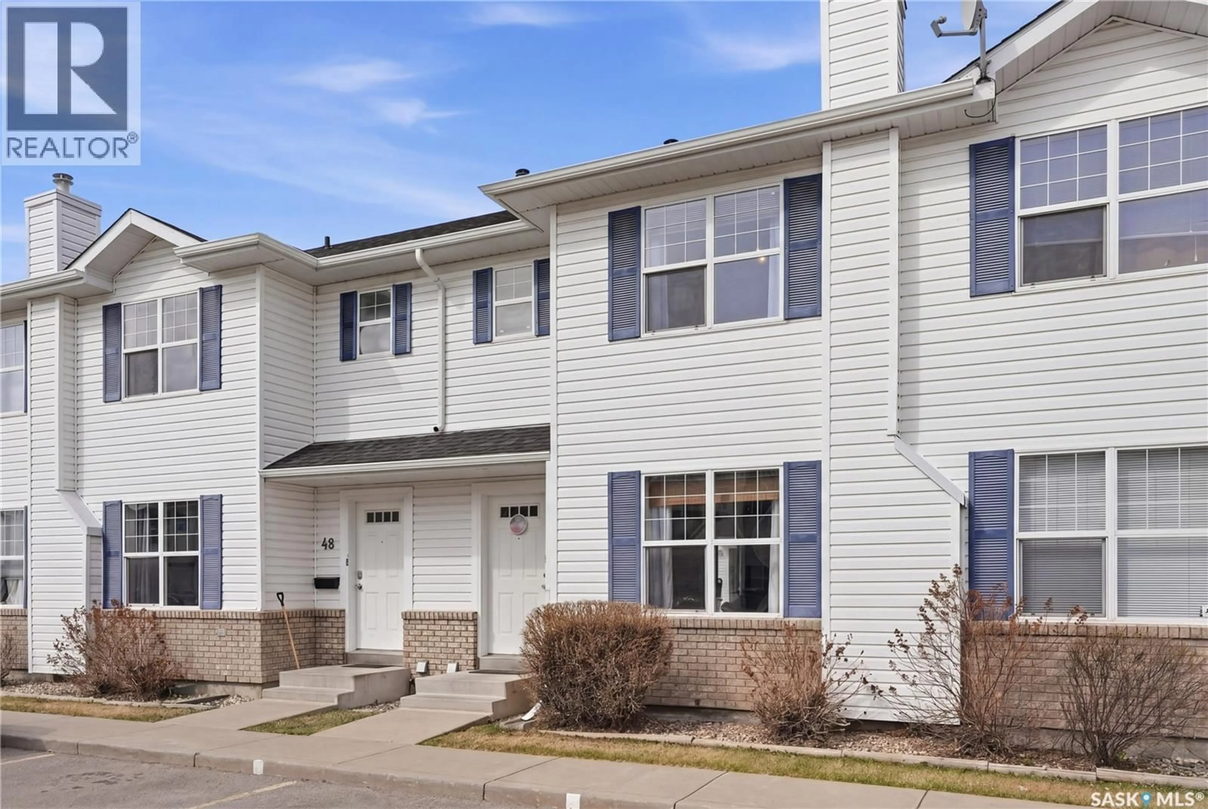 Home with vinyl exterior material, street for 49 203 HEROLD TERRACE, Saskatoon Saskatchewan S7V1H3