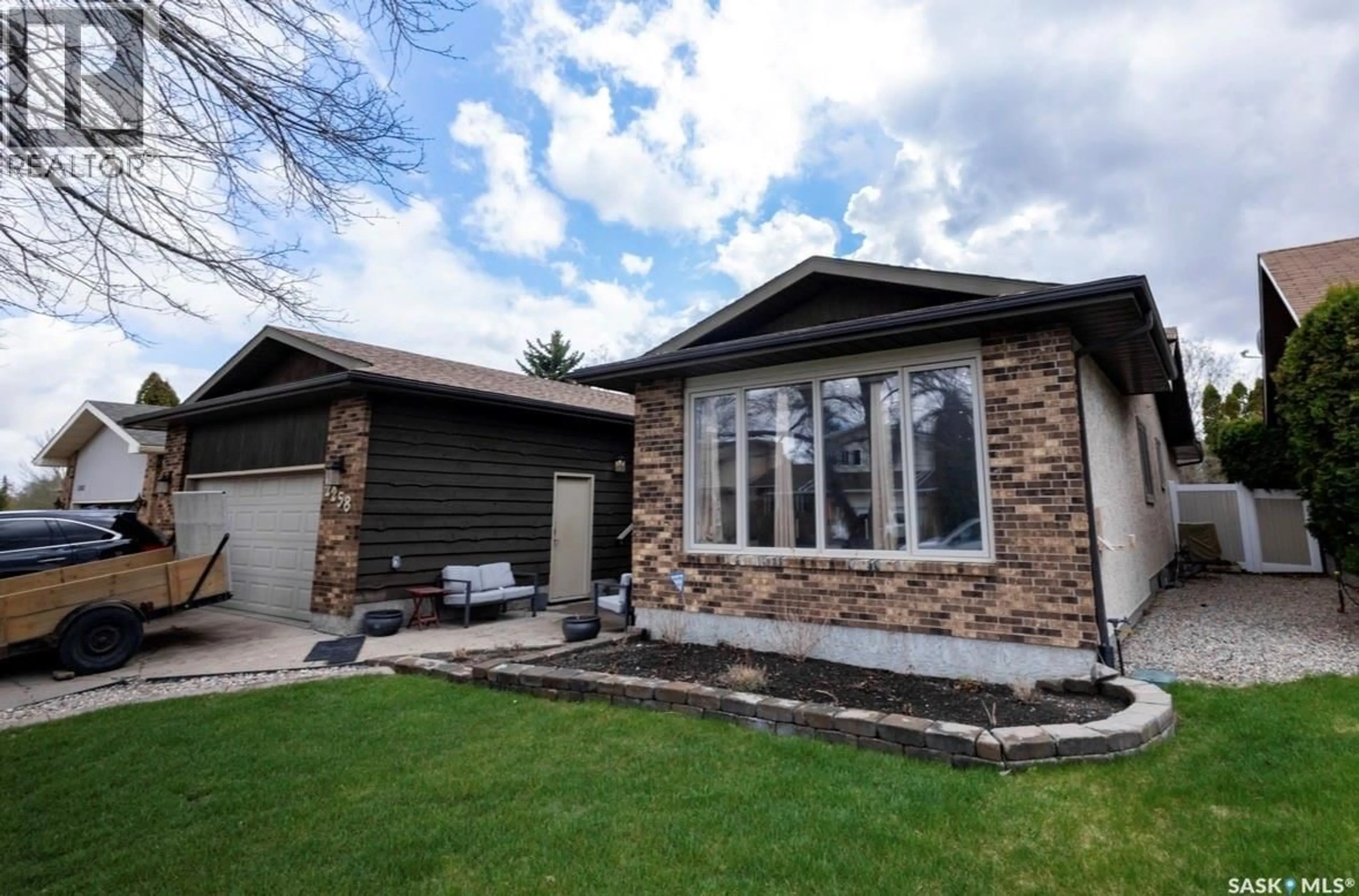 Home with vinyl exterior material, street for E - 2258 NEWIS BAY, Regina Saskatchewan S4V0S5