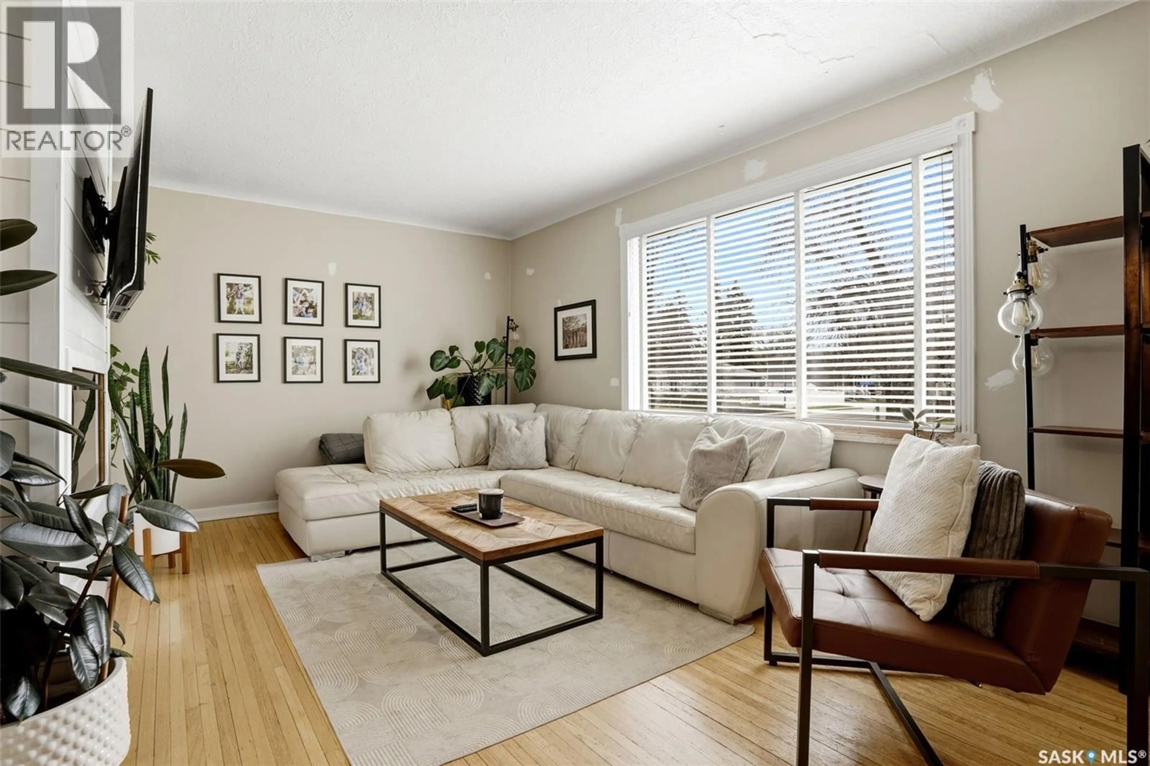 Living room with furniture, wood/laminate floor for 3410 MCCALLUM AVENUE, Regina Saskatchewan S4S0S1