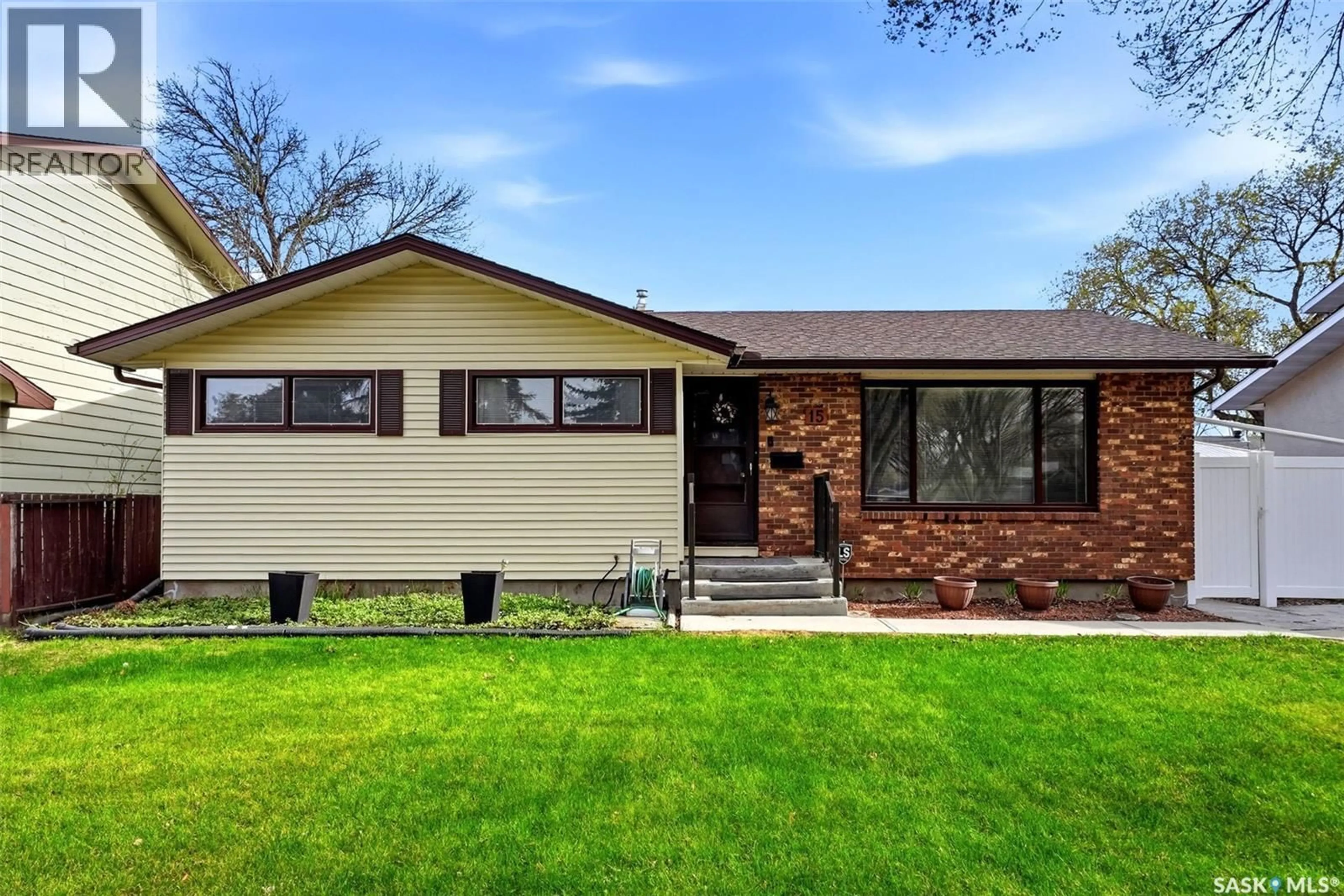 Home with vinyl exterior material, street for 15 HUDSON DRIVE, Regina Saskatchewan S4S2W1
