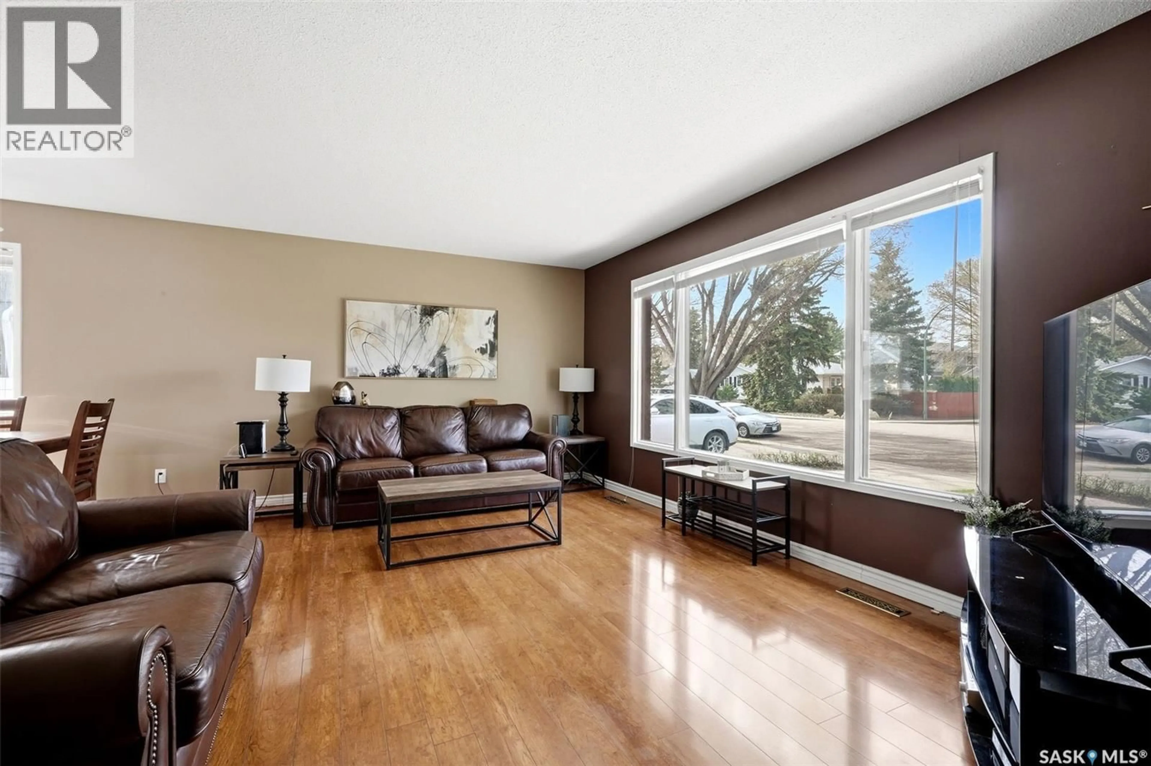 Living room with furniture, wood/laminate floor for 15 HUDSON DRIVE, Regina Saskatchewan S4S2W1