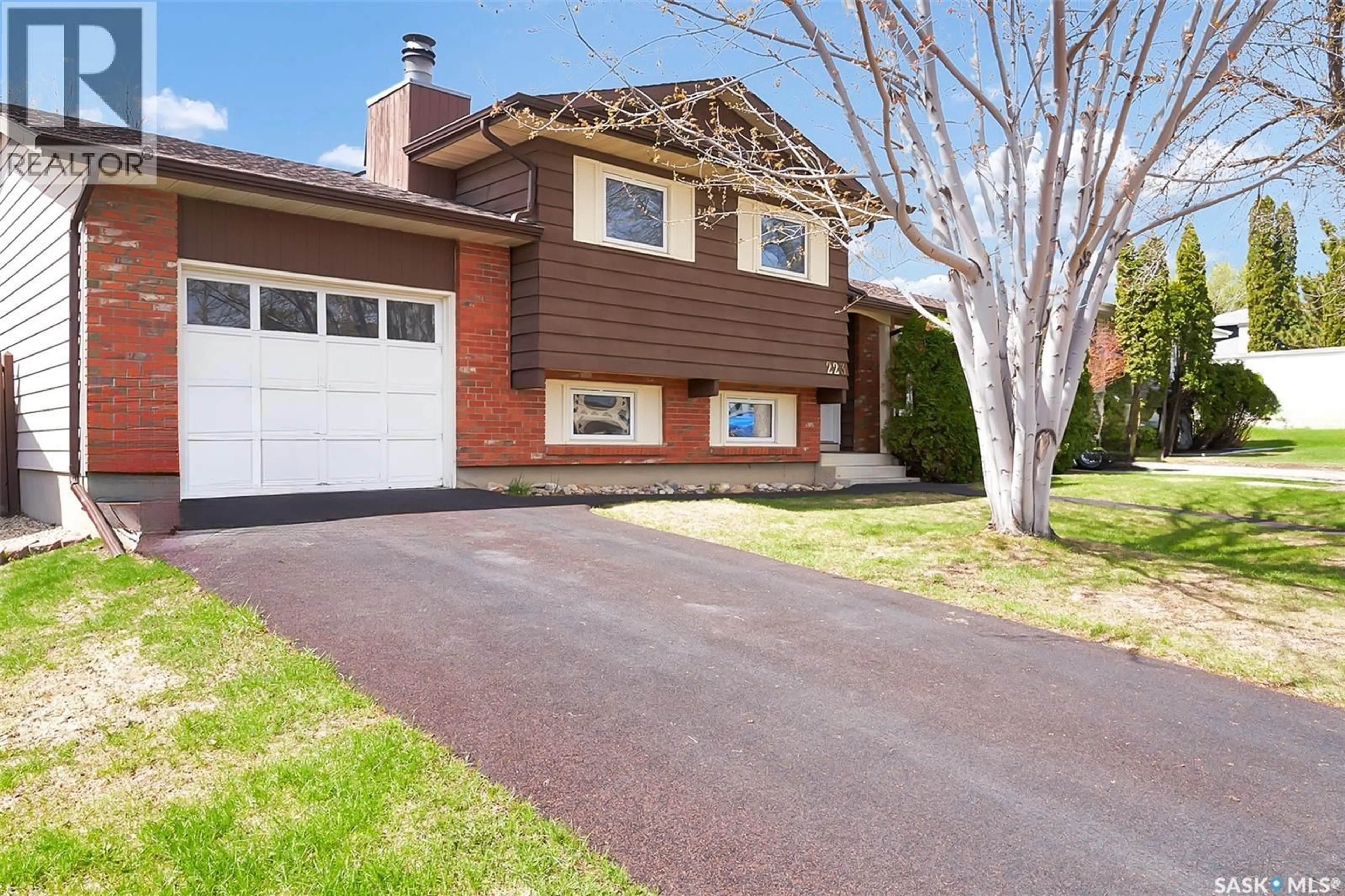 Home with vinyl exterior material, street for 223 PENRYN CRESCENT, Saskatoon Saskatchewan S7H5G5