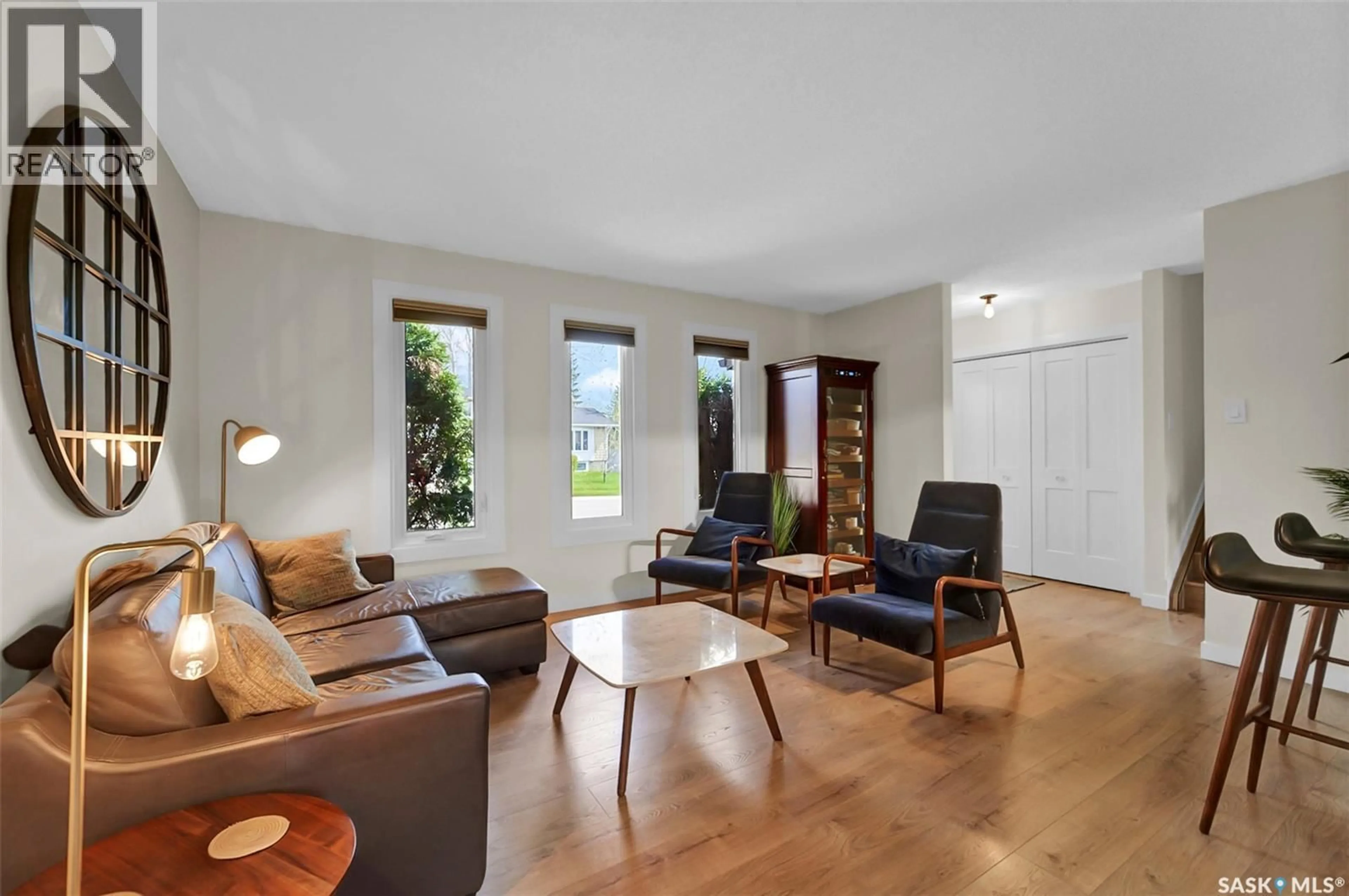 Living room with furniture, wood/laminate floor for 223 PENRYN CRESCENT, Saskatoon Saskatchewan S7H5G5