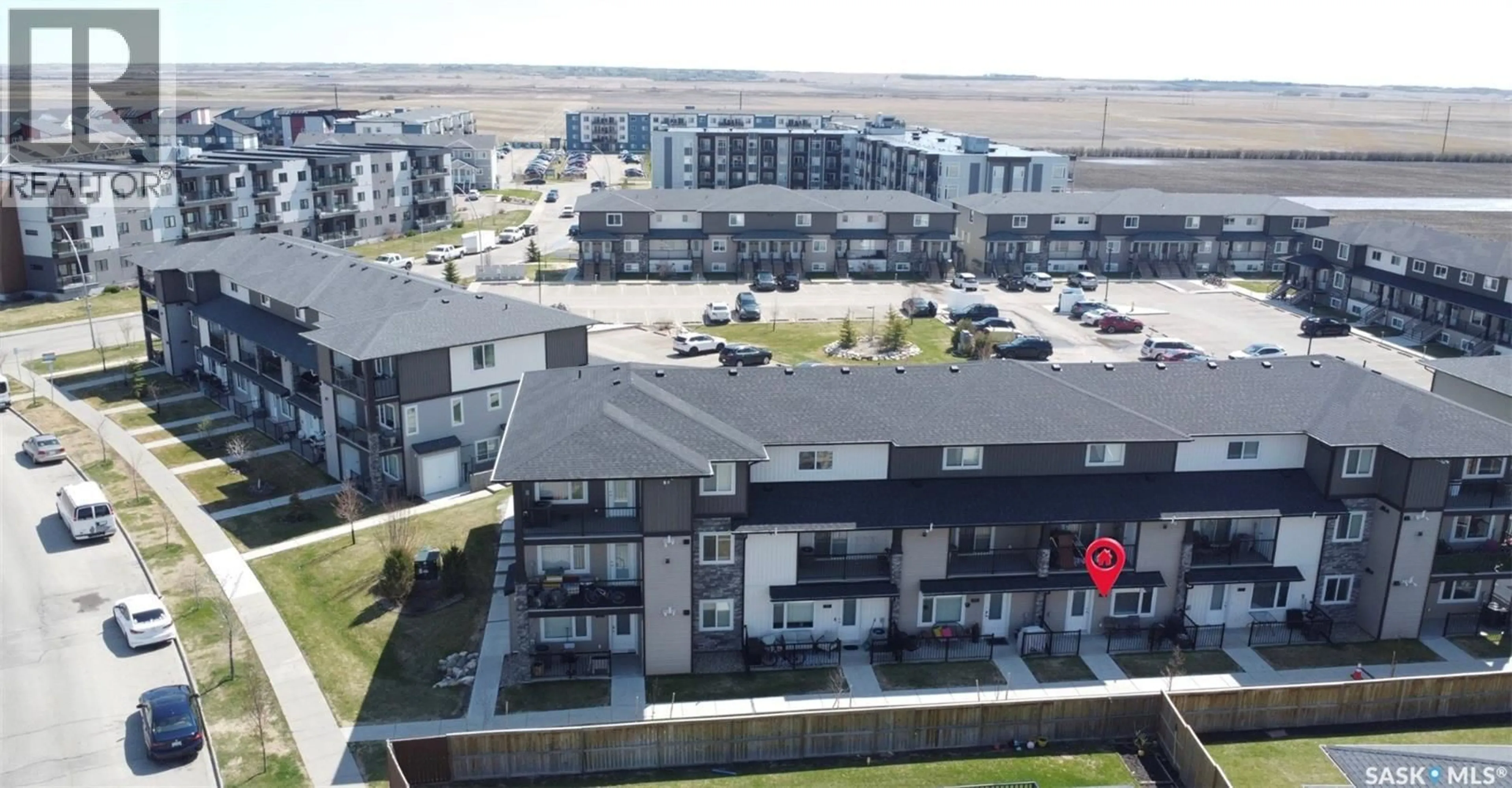 A pic from outside/outdoor area/front of a property/back of a property/a pic from drone, unknown for 503 110 AKHTAR BEND, Saskatoon Saskatchewan S7W0X5