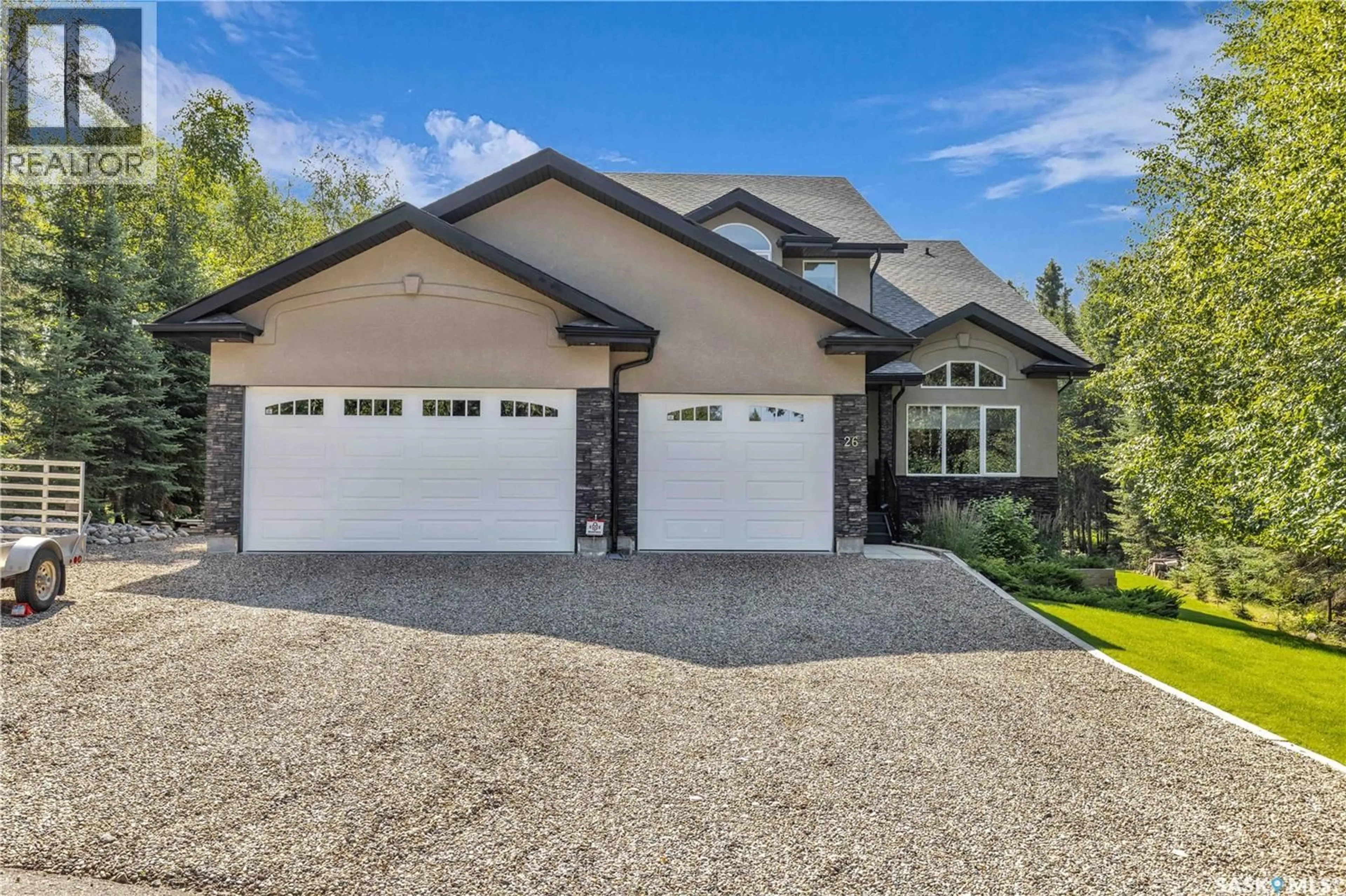 Home with vinyl exterior material, street for 26 ESTATES DRIVE, Elk Ridge Saskatchewan S0J2Y0