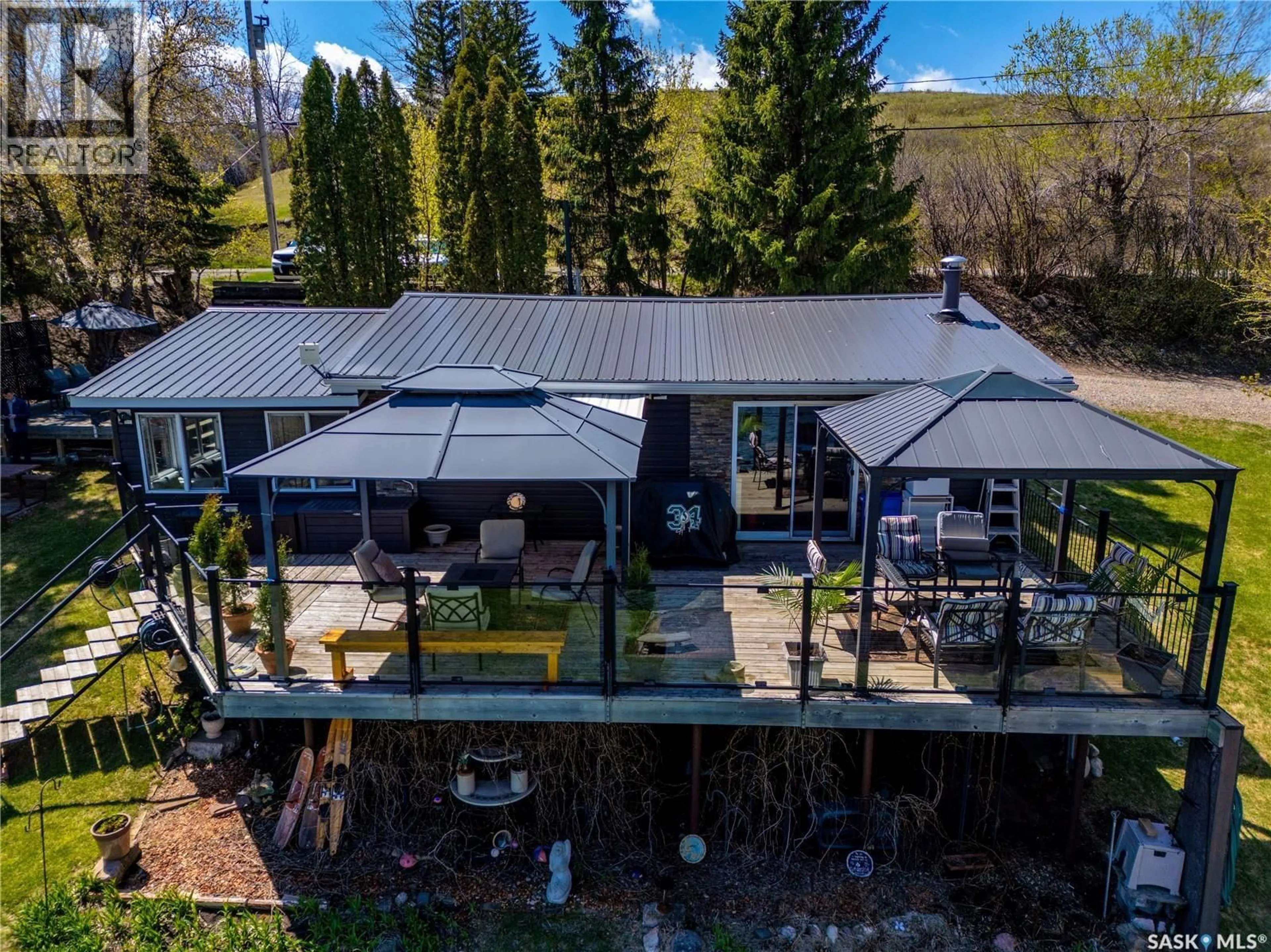 A pic from outside/outdoor area/front of a property/back of a property/a pic from drone, mountain view for 408 TATANKA DRIVE, Sun Valley Saskatchewan S6H4P2