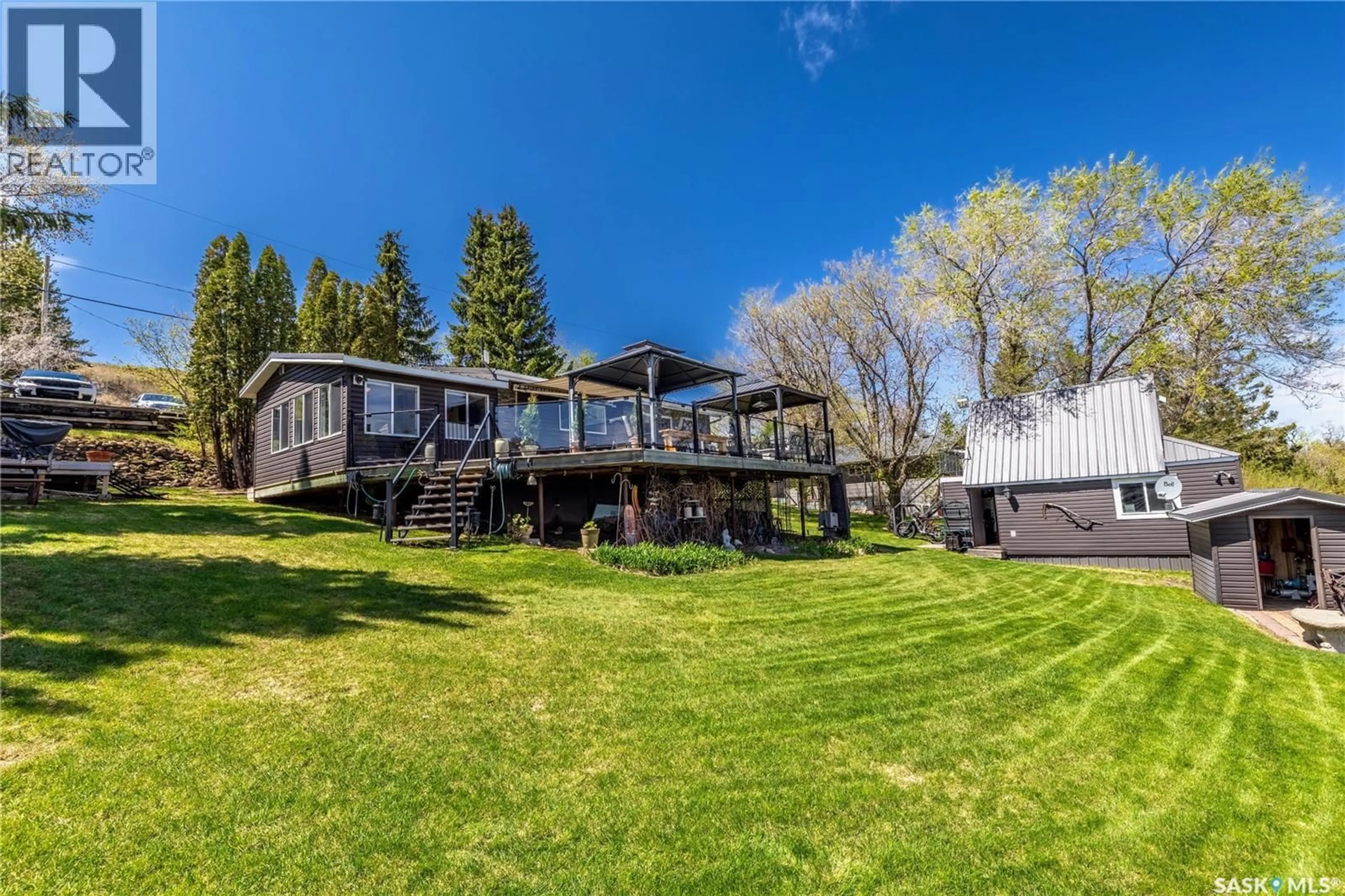 A pic from outside/outdoor area/front of a property/back of a property/a pic from drone, water/lake/river/ocean view for 408 TATANKA DRIVE, Sun Valley Saskatchewan S6H4P2