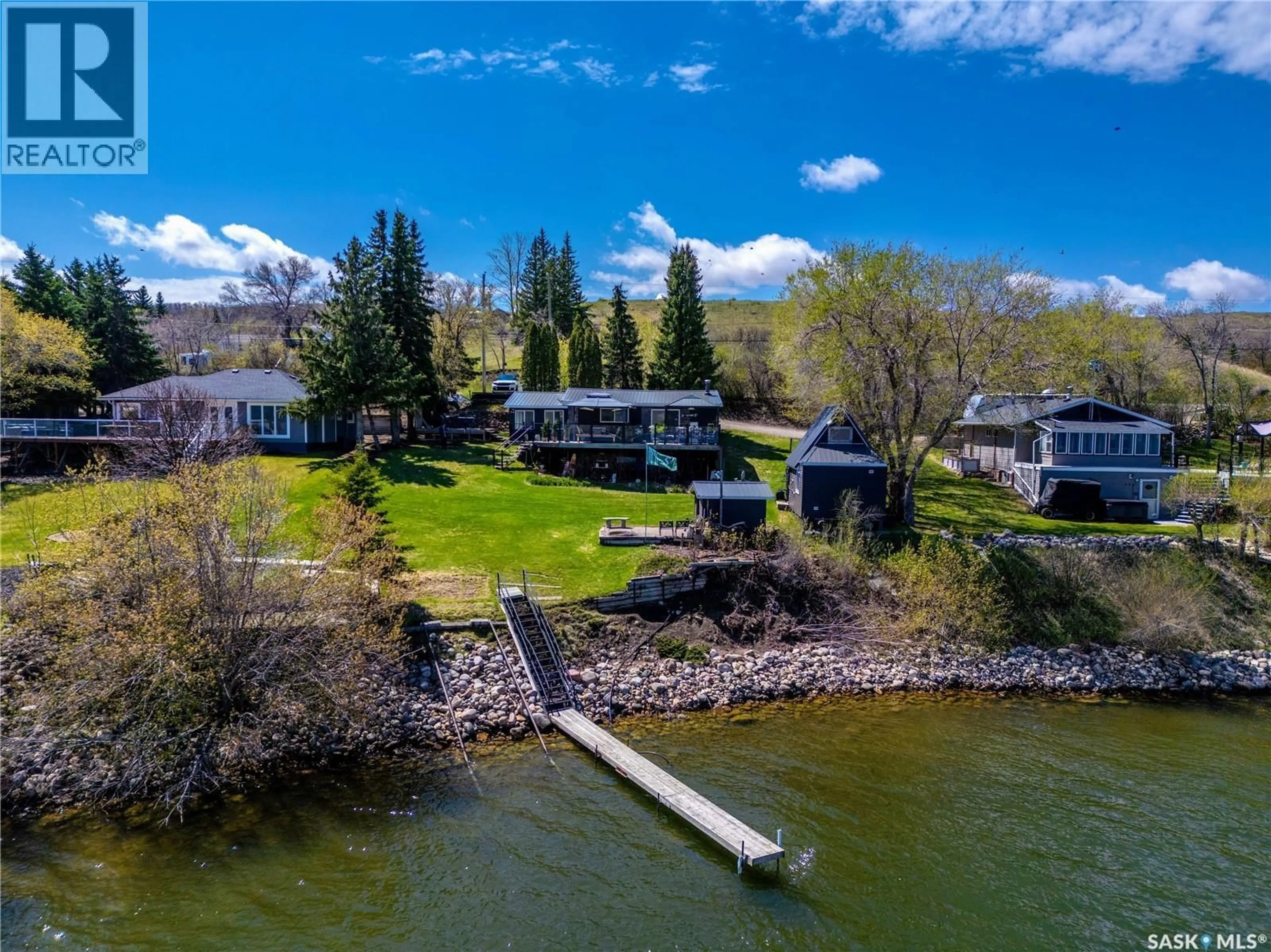 A pic from outside/outdoor area/front of a property/back of a property/a pic from drone, water/lake/river/ocean view for 408 TATANKA DRIVE, Sun Valley Saskatchewan S6H4P2