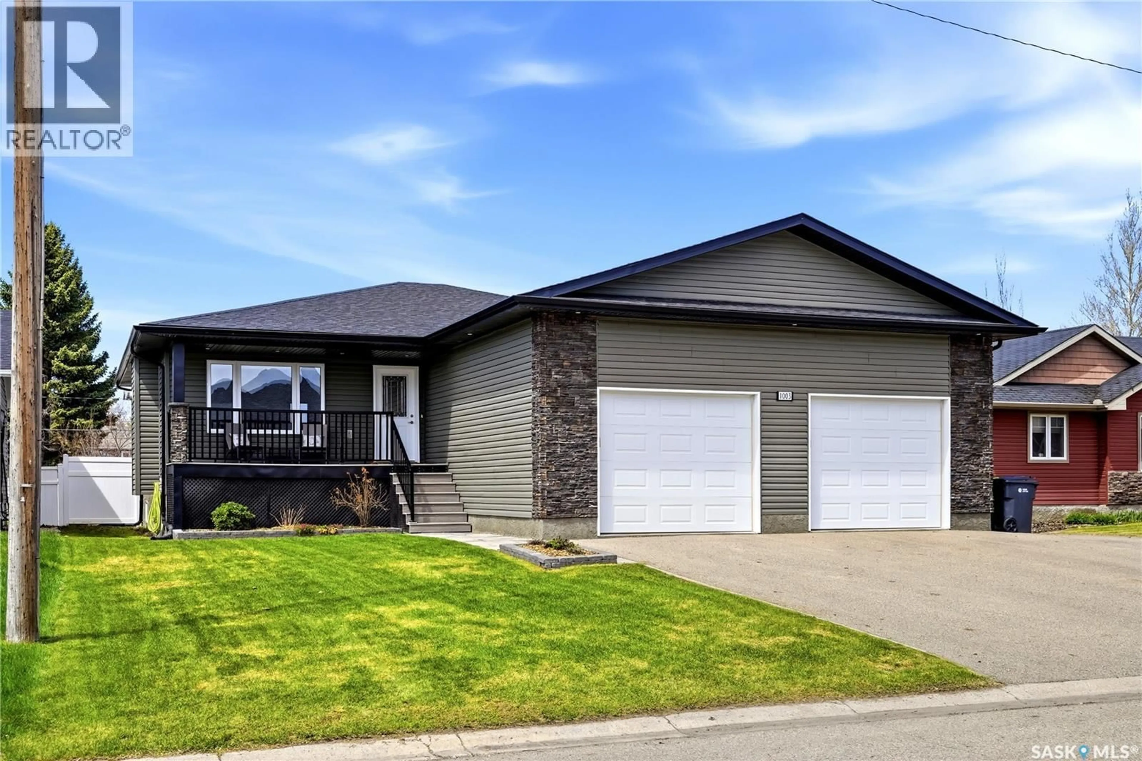 Home with vinyl exterior material, street for 1003 DEWDNEY STREET, Indian Head Saskatchewan S0G2K0