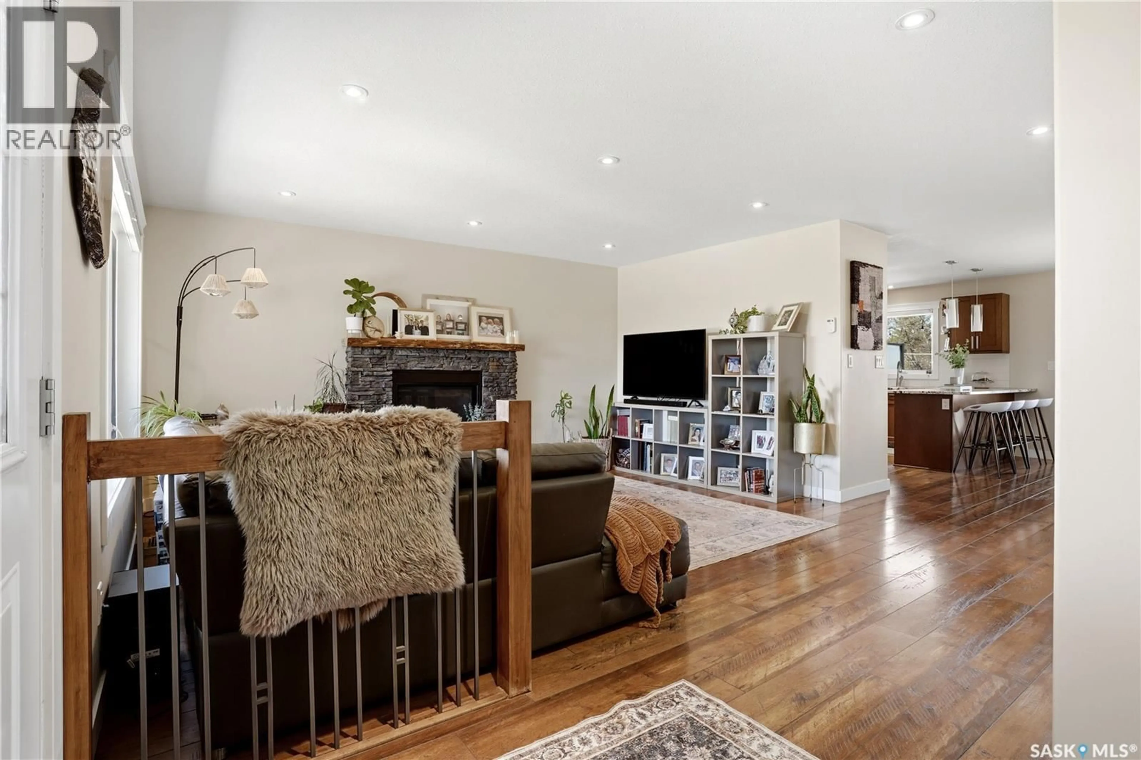 Living room with furniture, wood/laminate floor for 1003 DEWDNEY STREET, Indian Head Saskatchewan S0G2K0