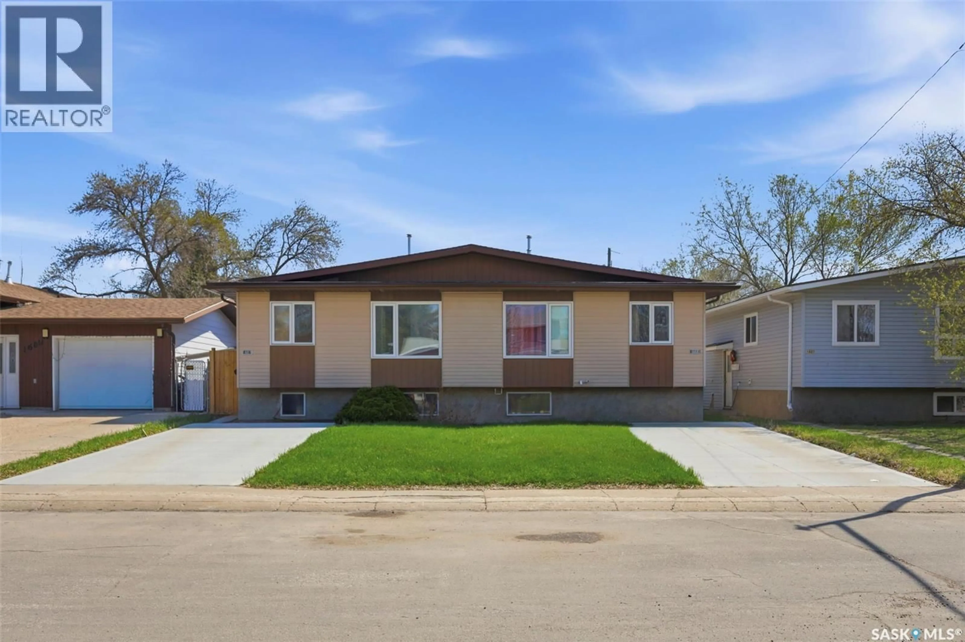 Home with vinyl exterior material, street for 1605-1607 LAURA AVENUE, Saskatoon Saskatchewan S7N2T2