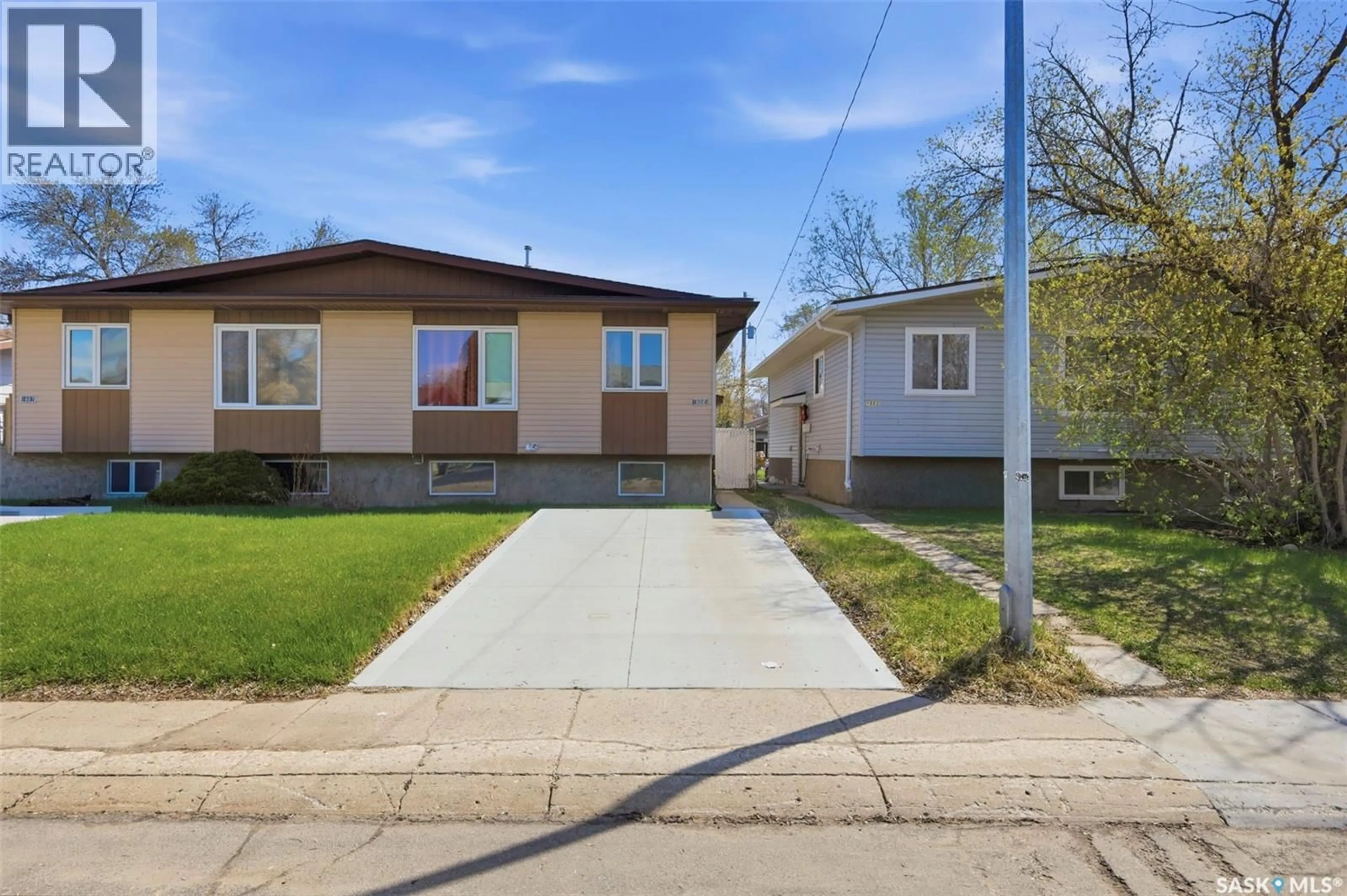 Home with vinyl exterior material, street for 1605-1607 LAURA AVENUE, Saskatoon Saskatchewan S7N2T2