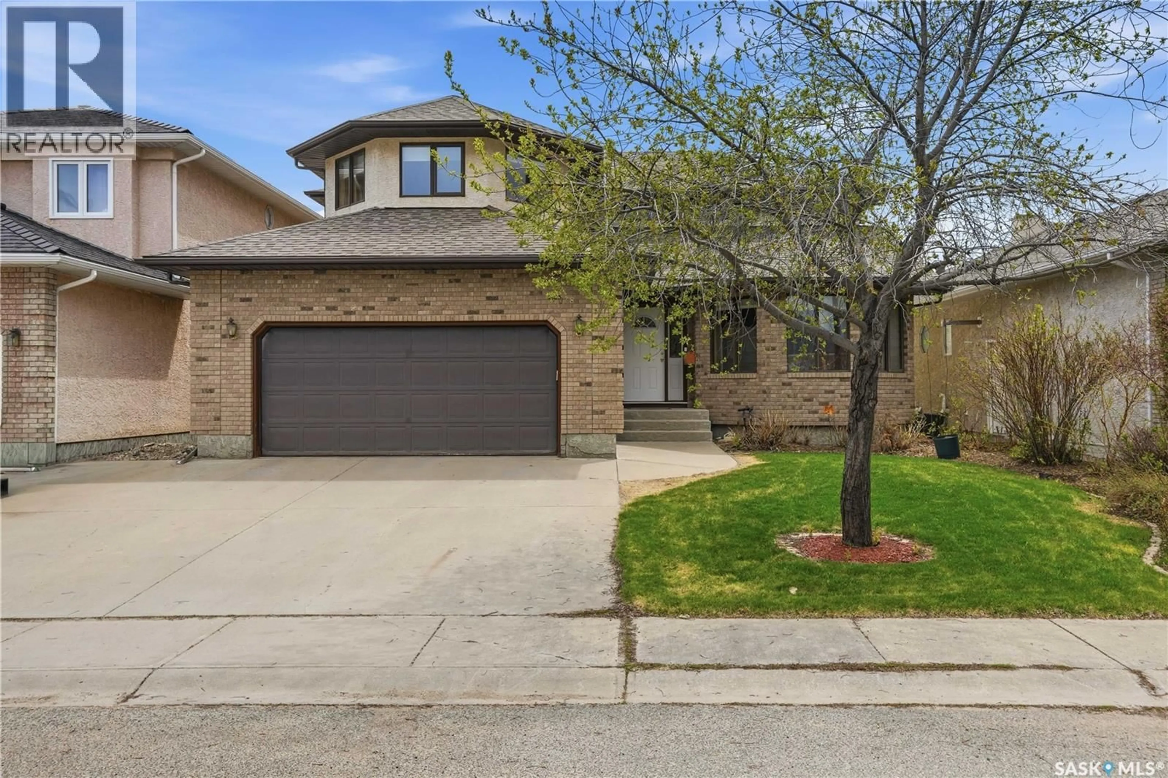 Home with brick exterior material, street for 5078 WASCANA VISTA COURT, Regina Saskatchewan S4V2S2