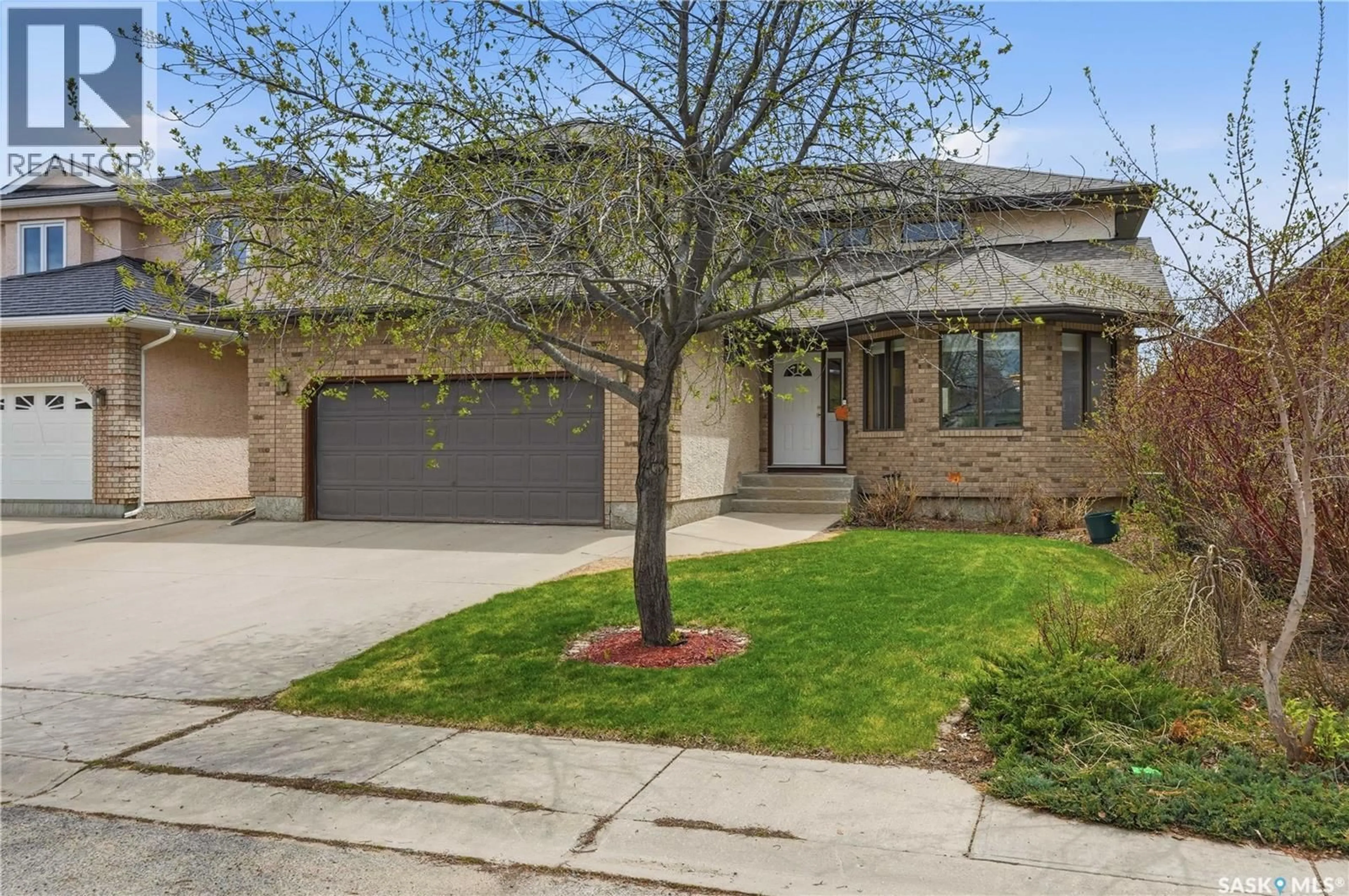 Home with brick exterior material, street for 5078 WASCANA VISTA COURT, Regina Saskatchewan S4V2S2