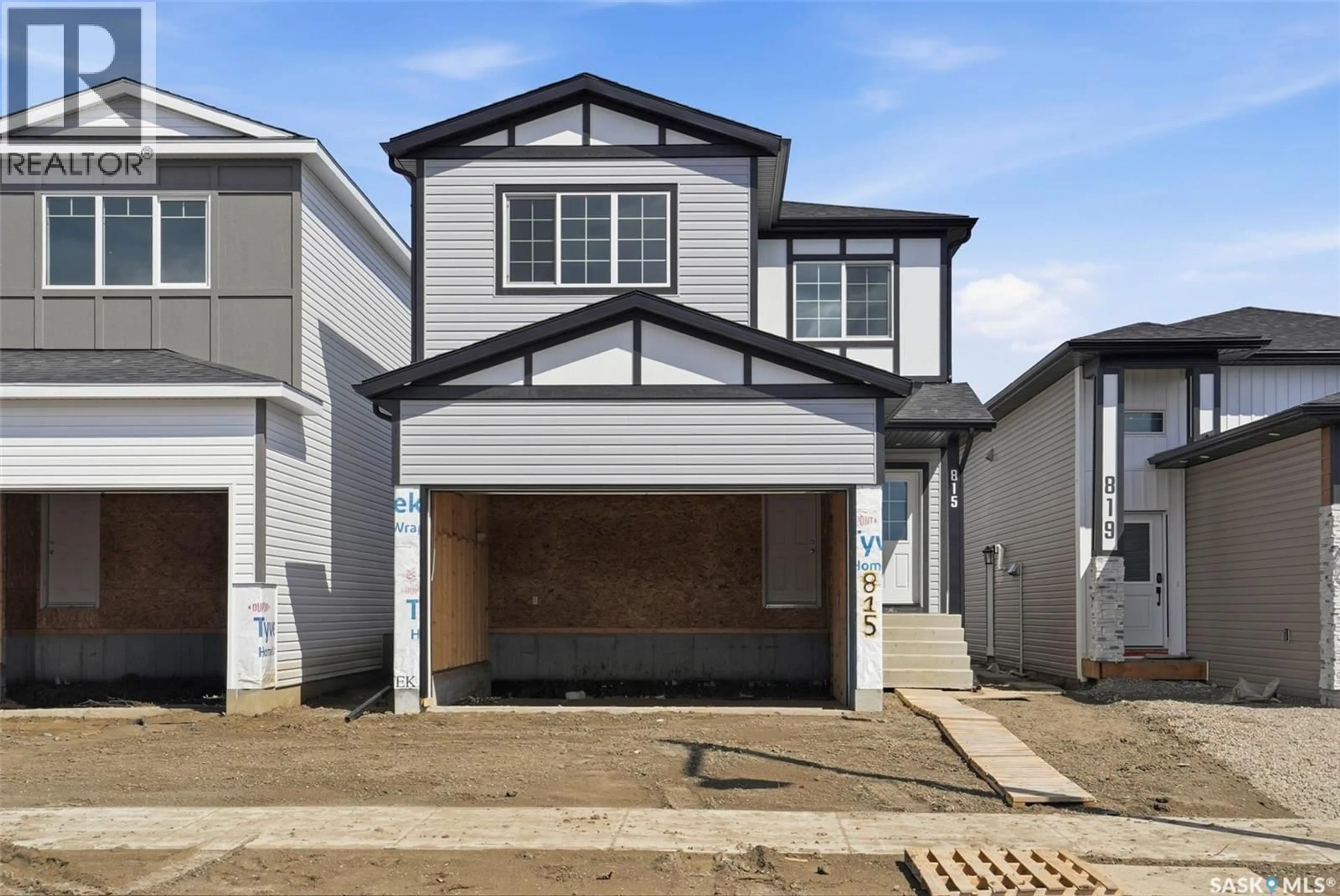 Home with vinyl exterior material, street for 815 BRIGHTON BOULEVARD, Saskatoon Saskatchewan S7V0Y4