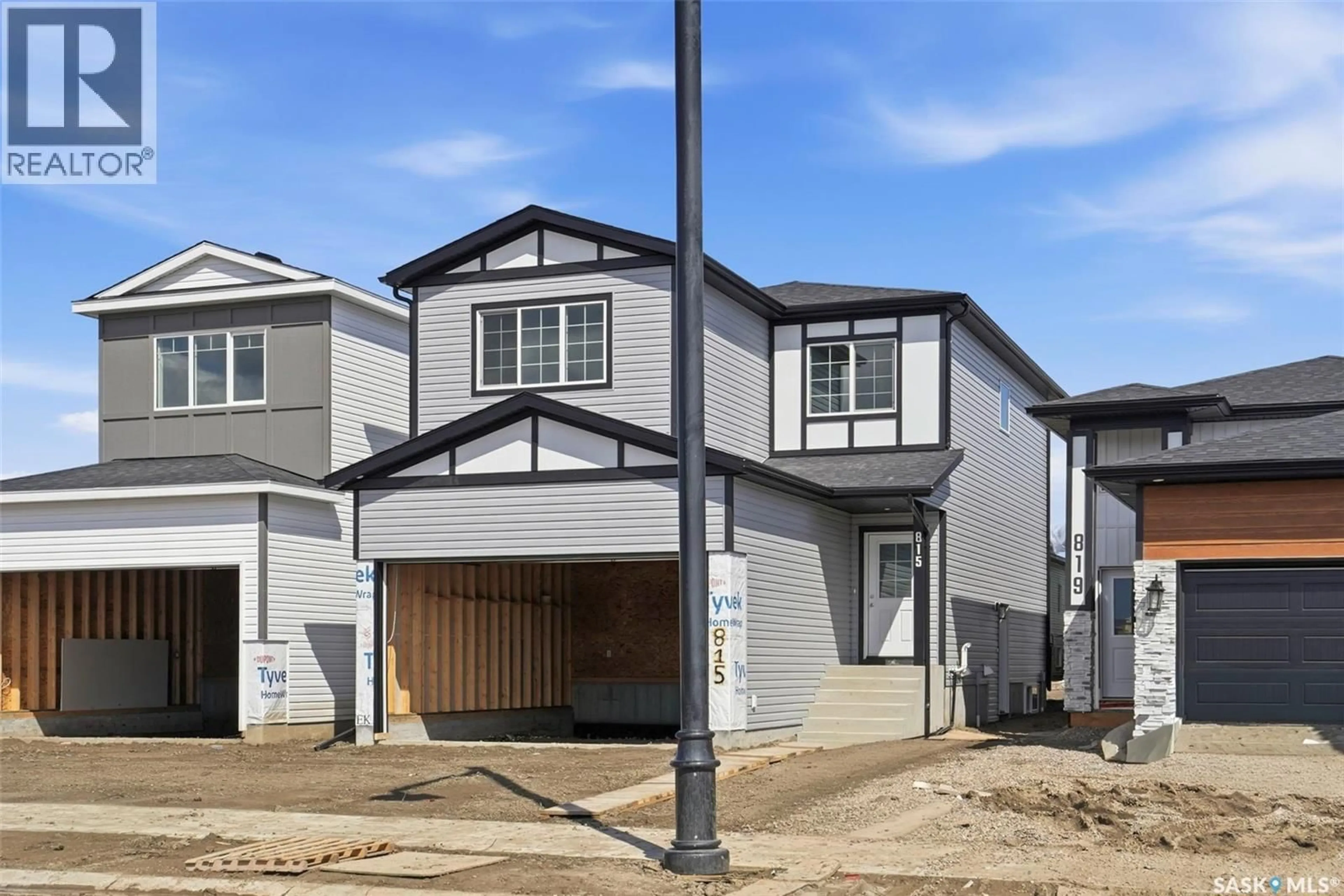 Home with vinyl exterior material, street for 815 BRIGHTON BOULEVARD, Saskatoon Saskatchewan S7V0Y4