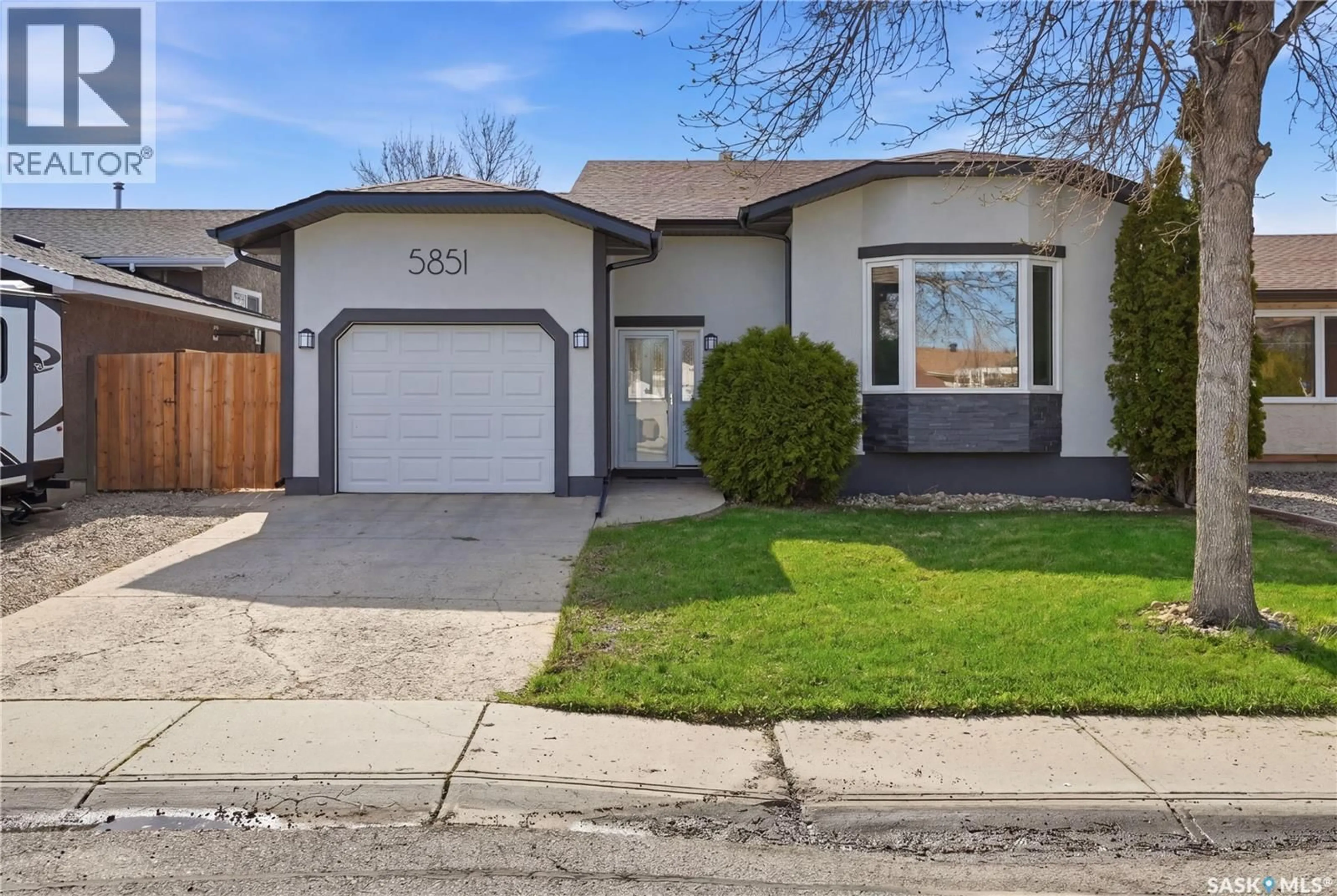 Home with vinyl exterior material, street for 5851 EHRLE CRESCENT, Regina Saskatchewan S4X4C4