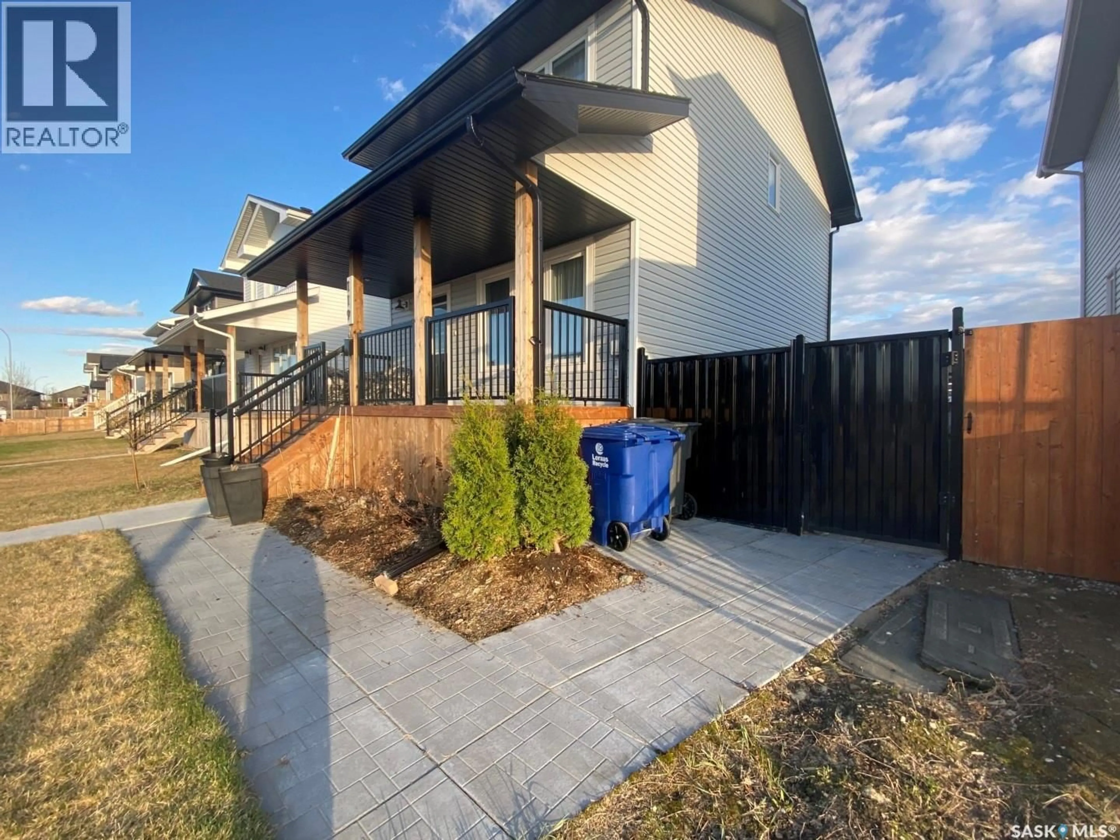 A pic from outside/outdoor area/front of a property/back of a property/a pic from drone, street for 119 REDDEKOPP CRESCENT, Warman Saskatchewan S0K4S3
