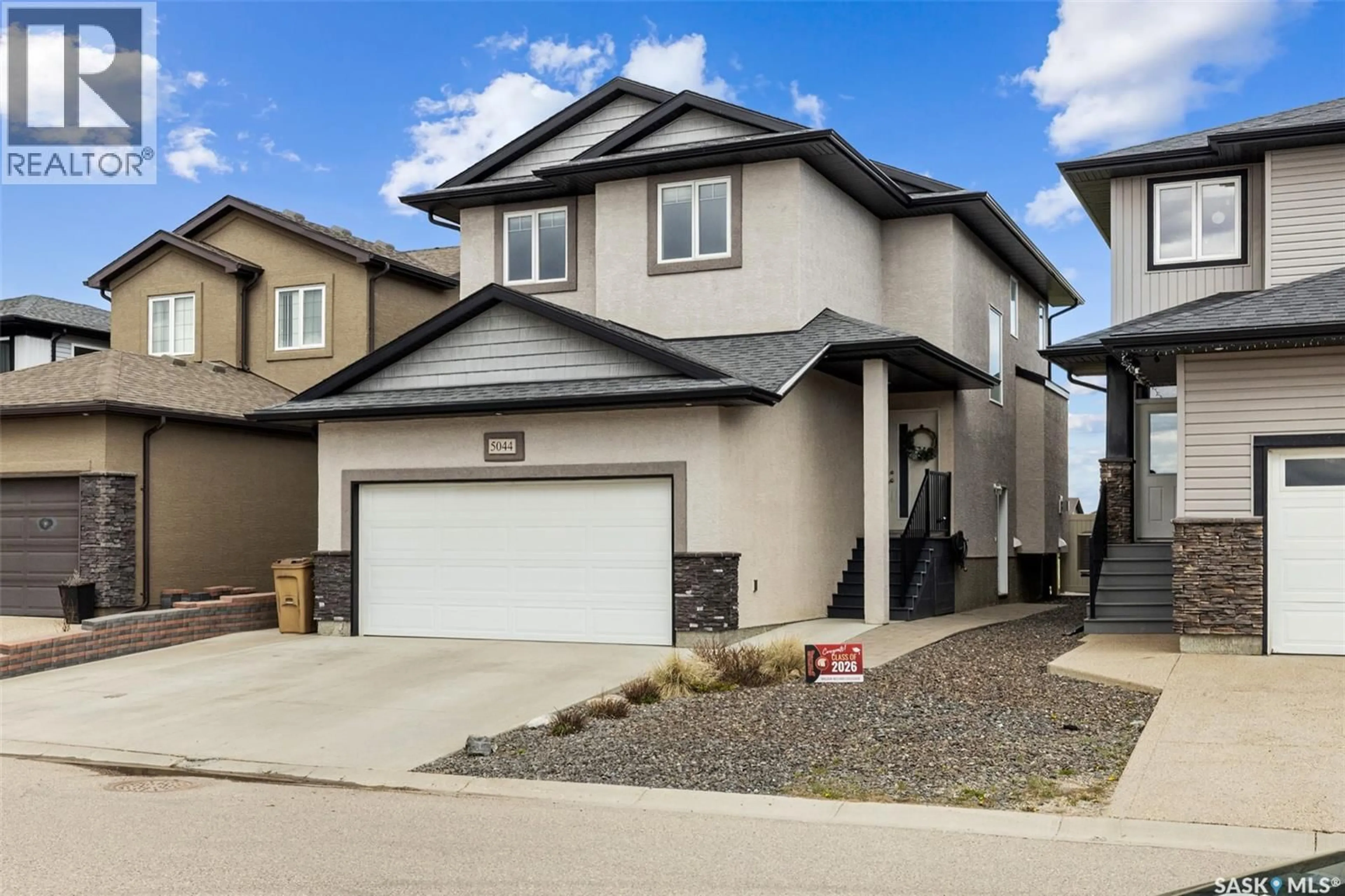 Home with vinyl exterior material, street for 5044 CRANE CRESCENT, Regina Saskatchewan S4W0B9