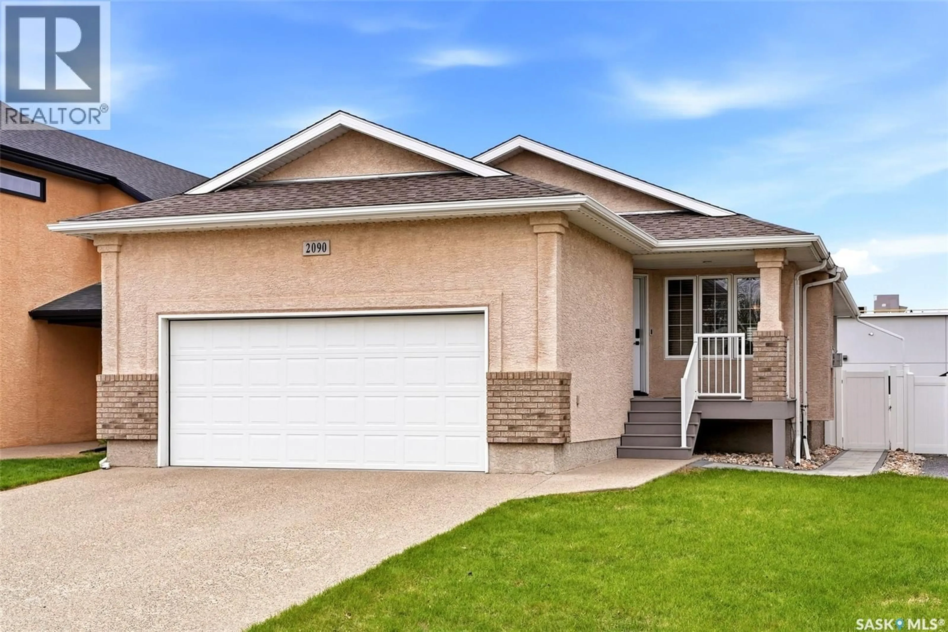 Home with vinyl exterior material, street for E - 2090 LAURIER BAY, Regina Saskatchewan S4V0P6