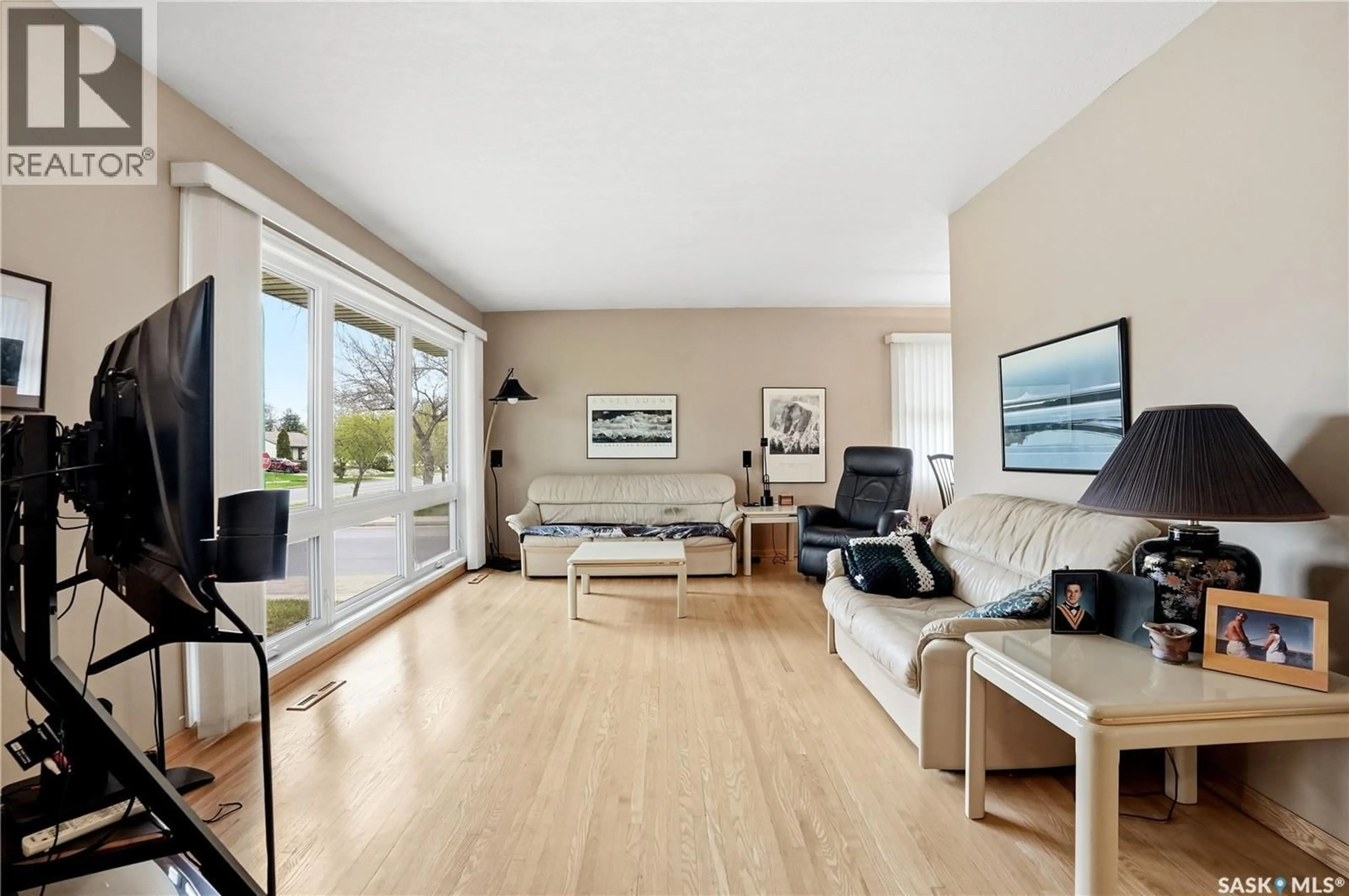 Living room with furniture, wood/laminate floor for 2601 PASQUA STREET, Regina Saskatchewan S4S0M4