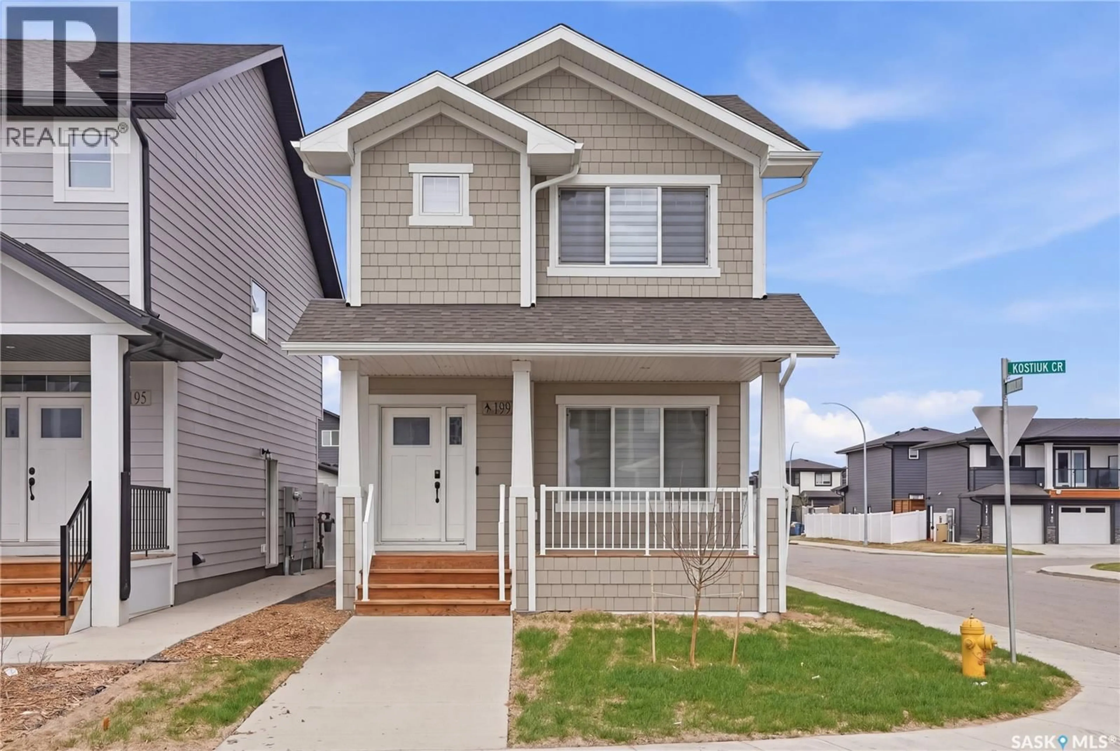 Home with vinyl exterior material, street for 199 KOSTIUK CRESCENT, Saskatoon Saskatchewan S7W0L8