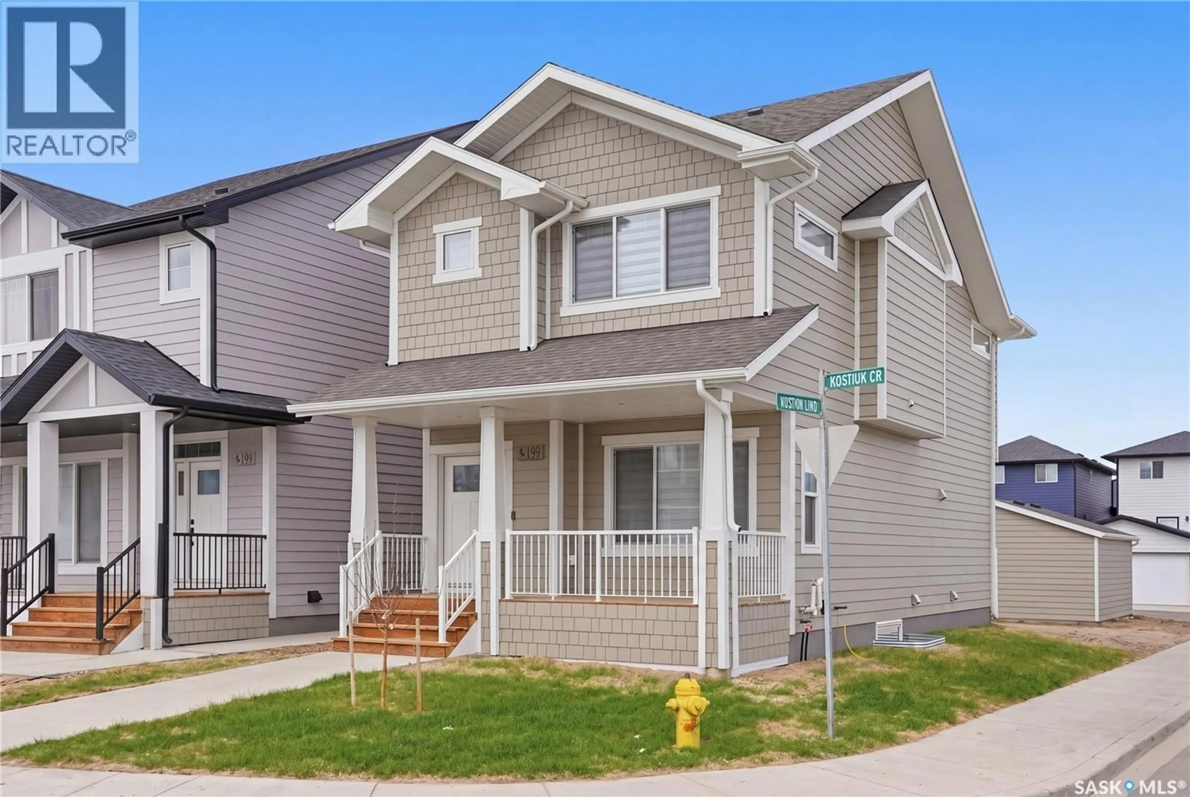 Home with vinyl exterior material, street for 199 KOSTIUK CRESCENT, Saskatoon Saskatchewan S7W0L8