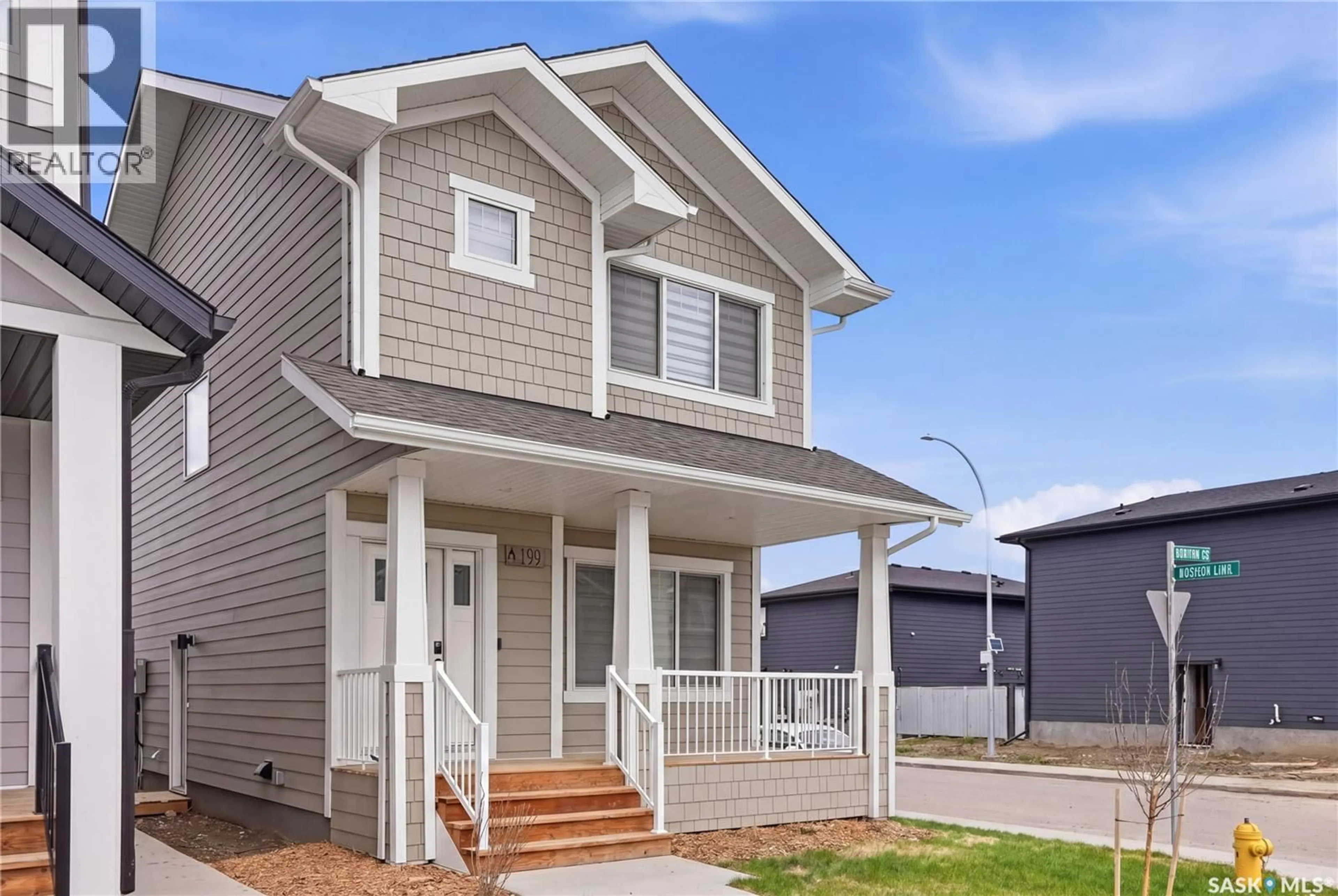 Home with vinyl exterior material, street for 199 KOSTIUK CRESCENT, Saskatoon Saskatchewan S7W0L8
