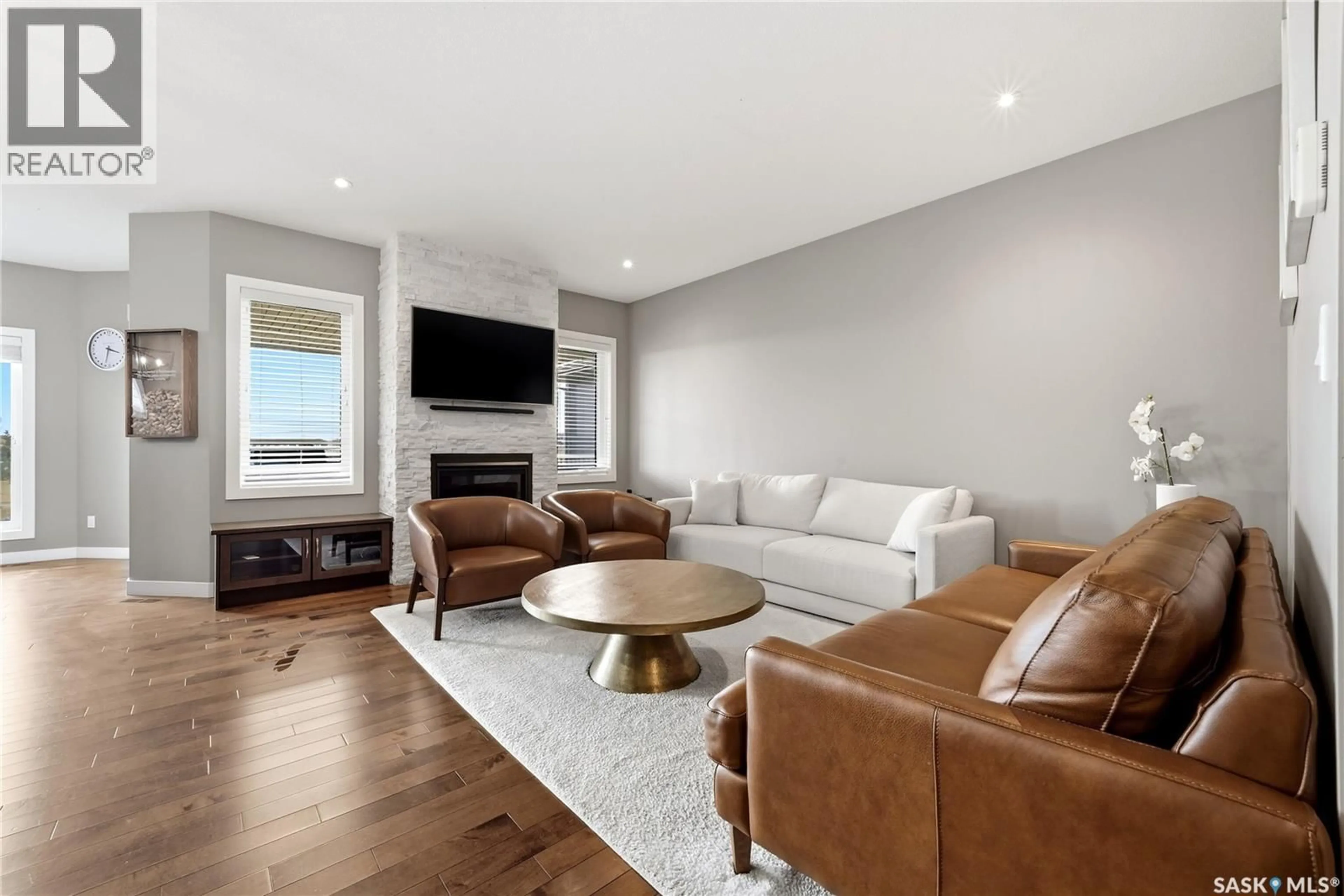 Living room with furniture, wood/laminate floor for 3504 GREEN LILY ROAD, Regina Saskatchewan S4V3M8