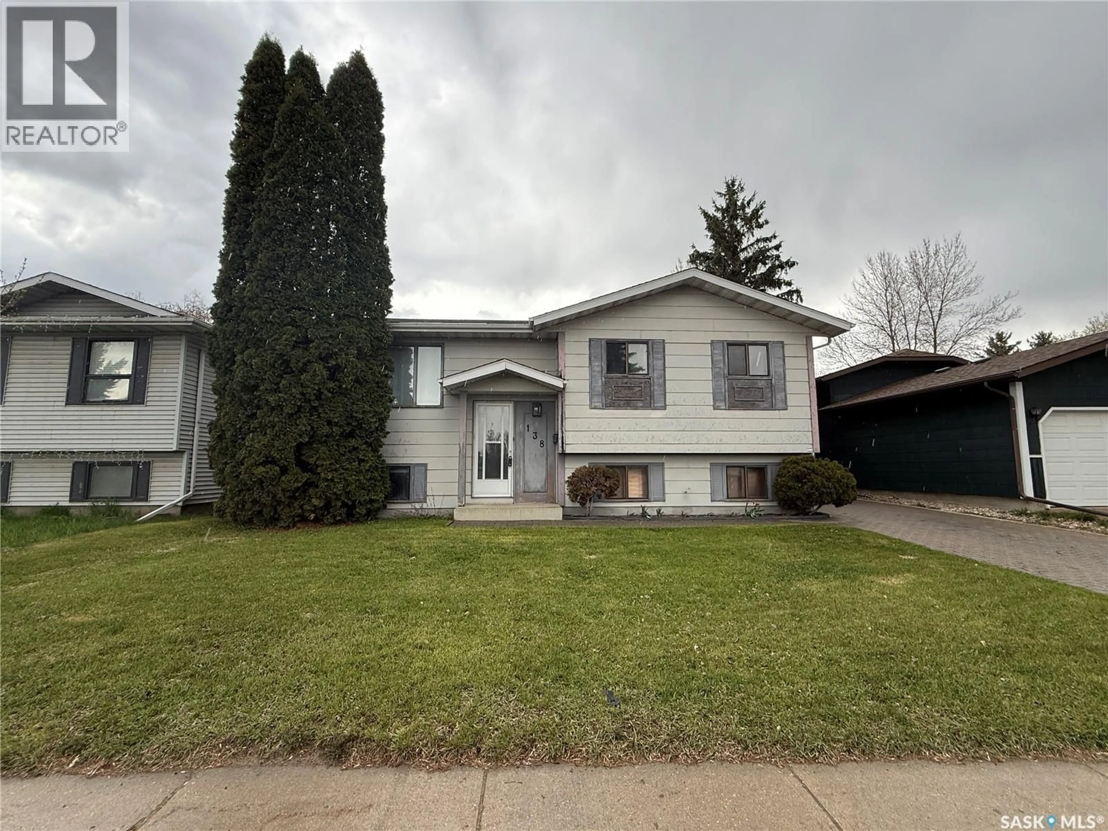 Home with vinyl exterior material, street for 138 WEYAKWIN DRIVE, Saskatoon Saskatchewan S7J4M5