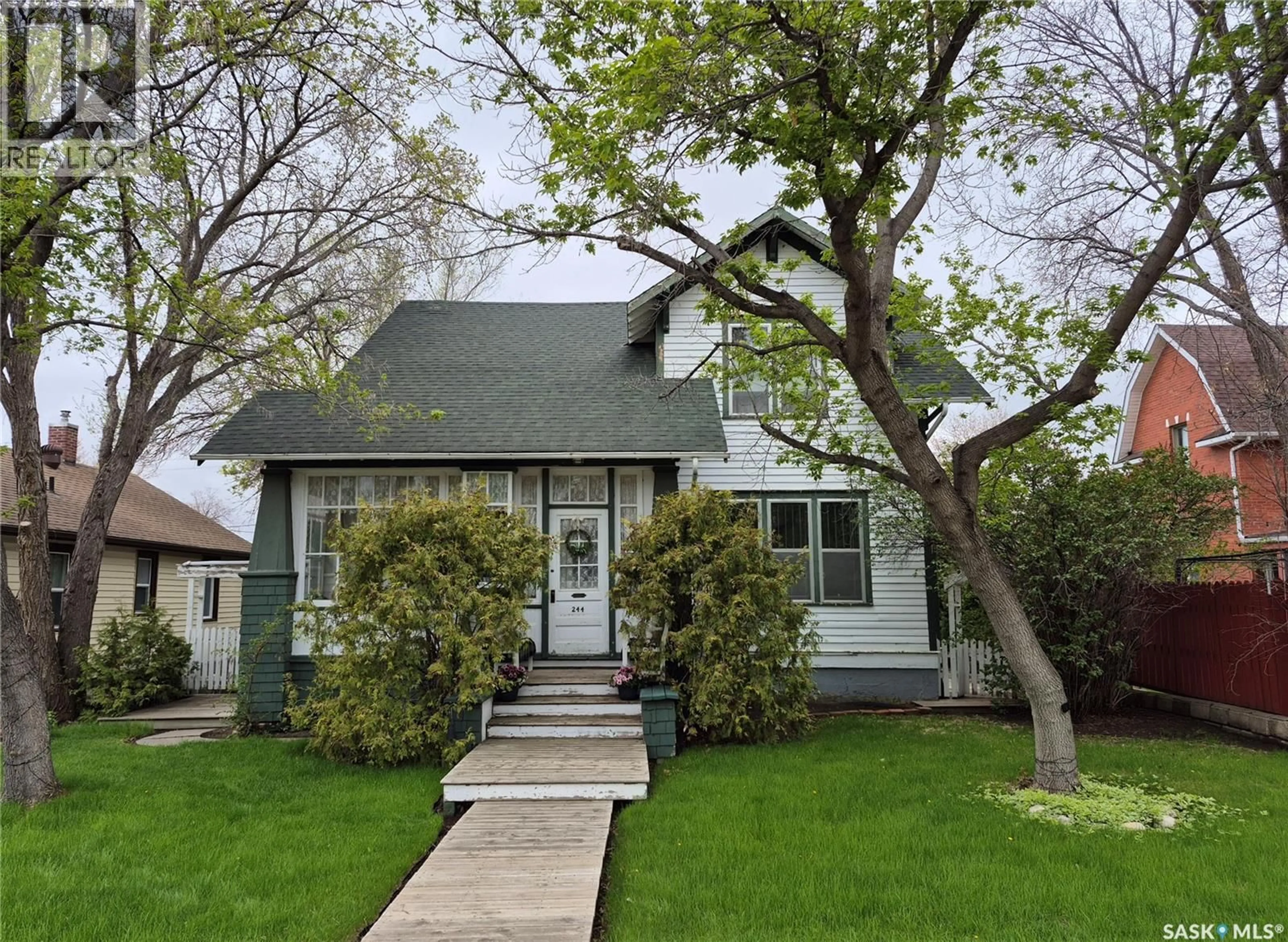 Home with vinyl exterior material, street for 244 3RD AVENUE, Swift Current Saskatchewan S9H0S1