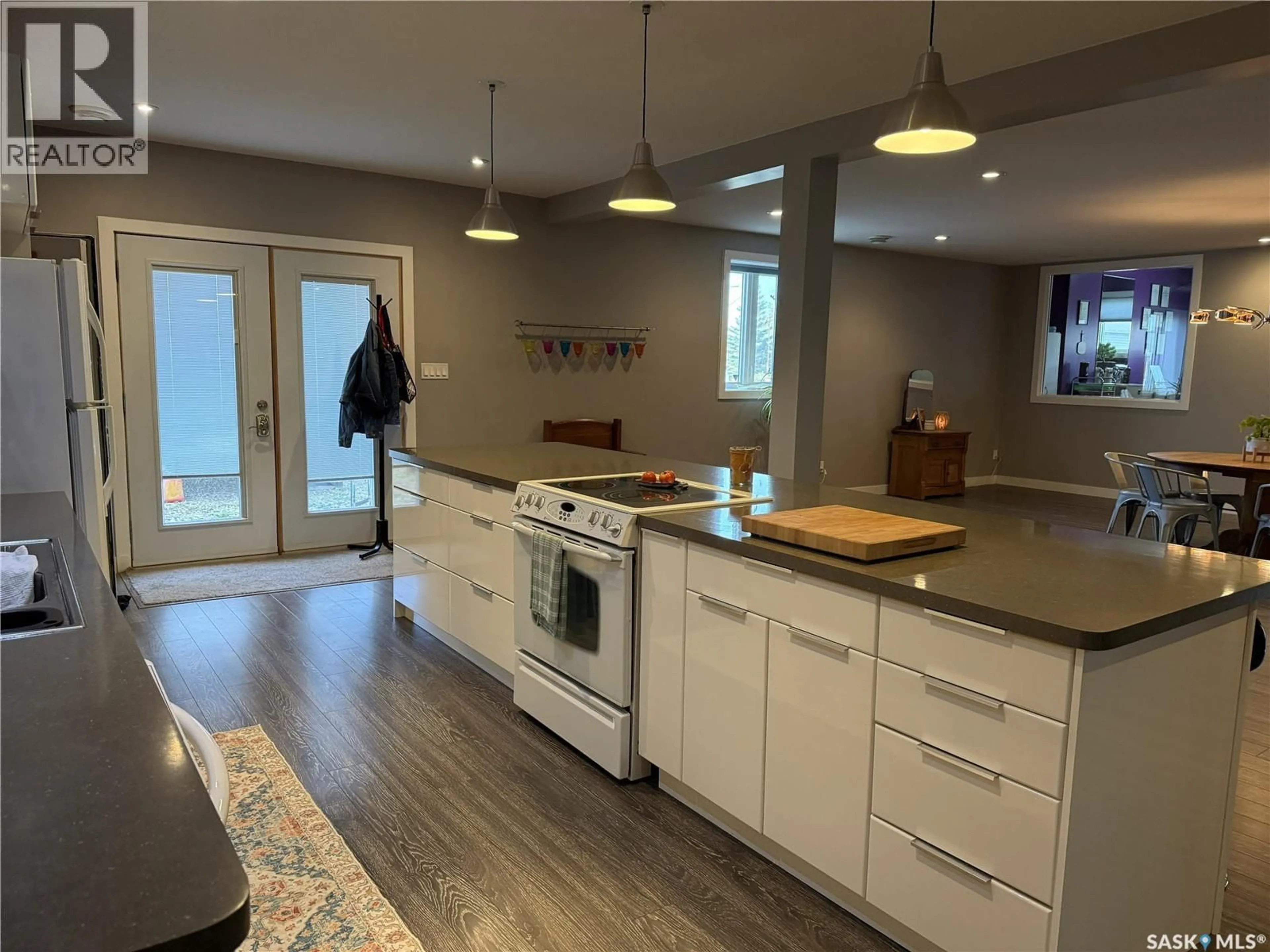 Open concept kitchen, wood/laminate floor for 103 SOURIS STREET, Yellow Grass Saskatchewan S0G5J0