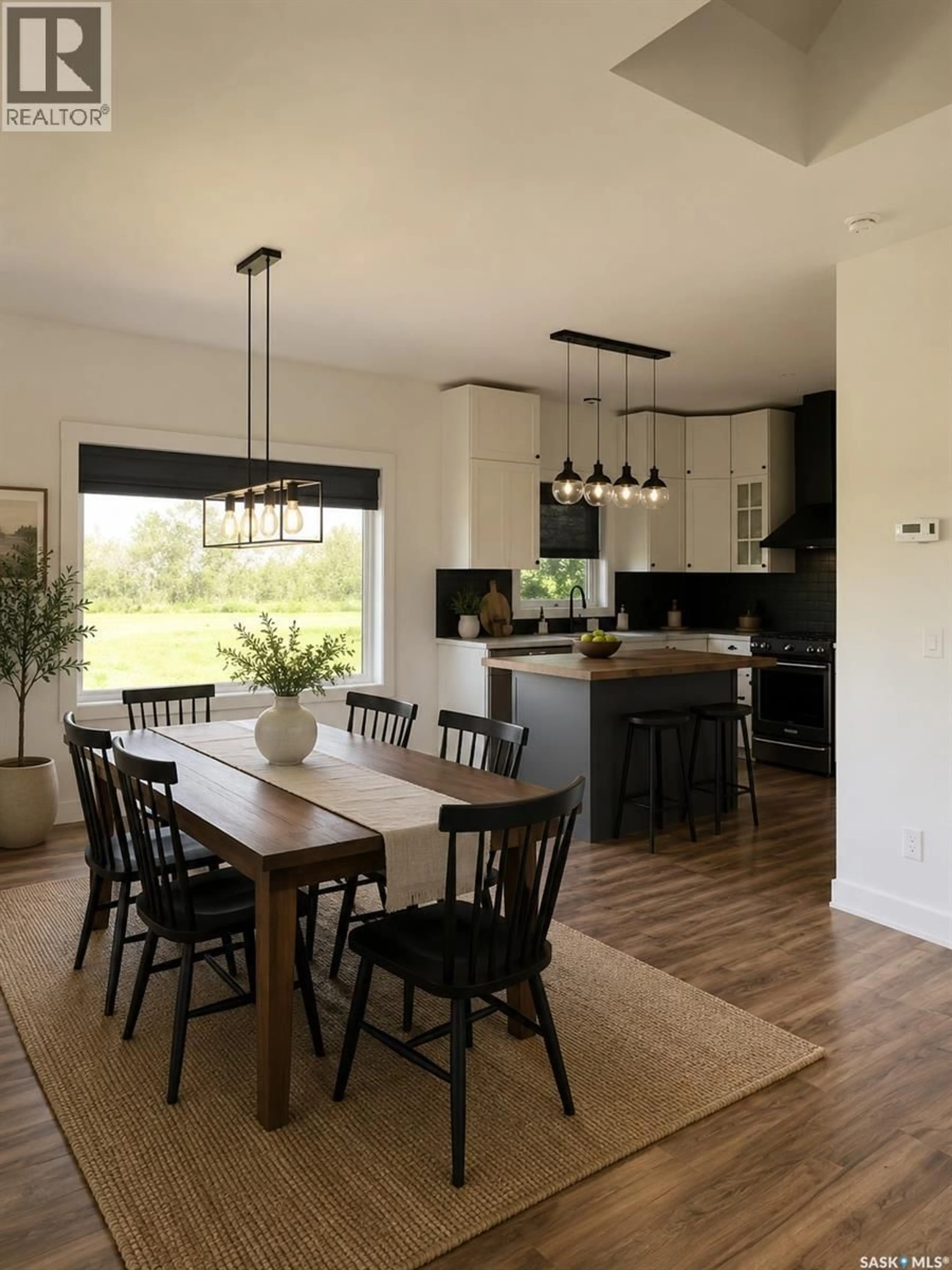 Open concept kitchen, wood/laminate floor for WIWCHAR ACREAGE, Vanscoy Rm No. 345 Saskatchewan S0L2L0