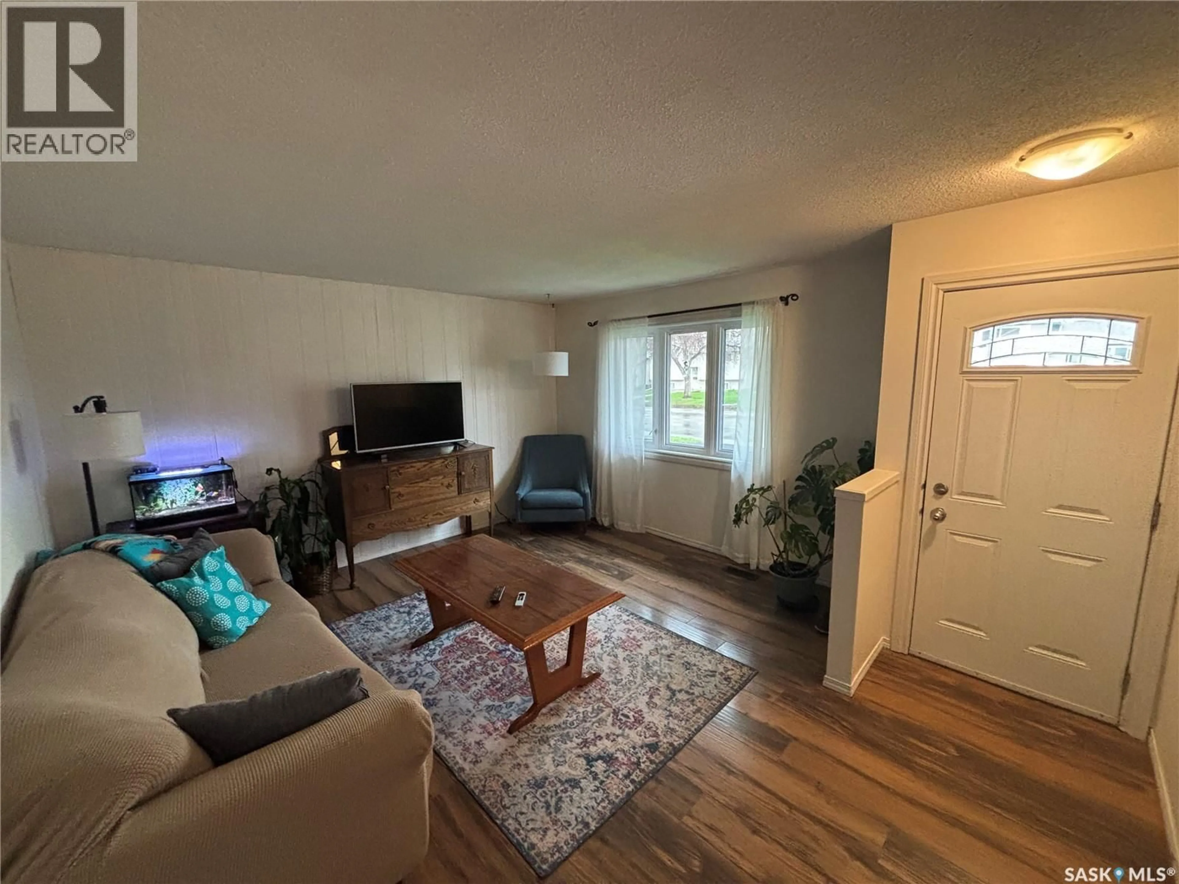 Living room with furniture, wood/laminate floor for 358 BRUCE STREET, Regina Saskatchewan S4R5H1