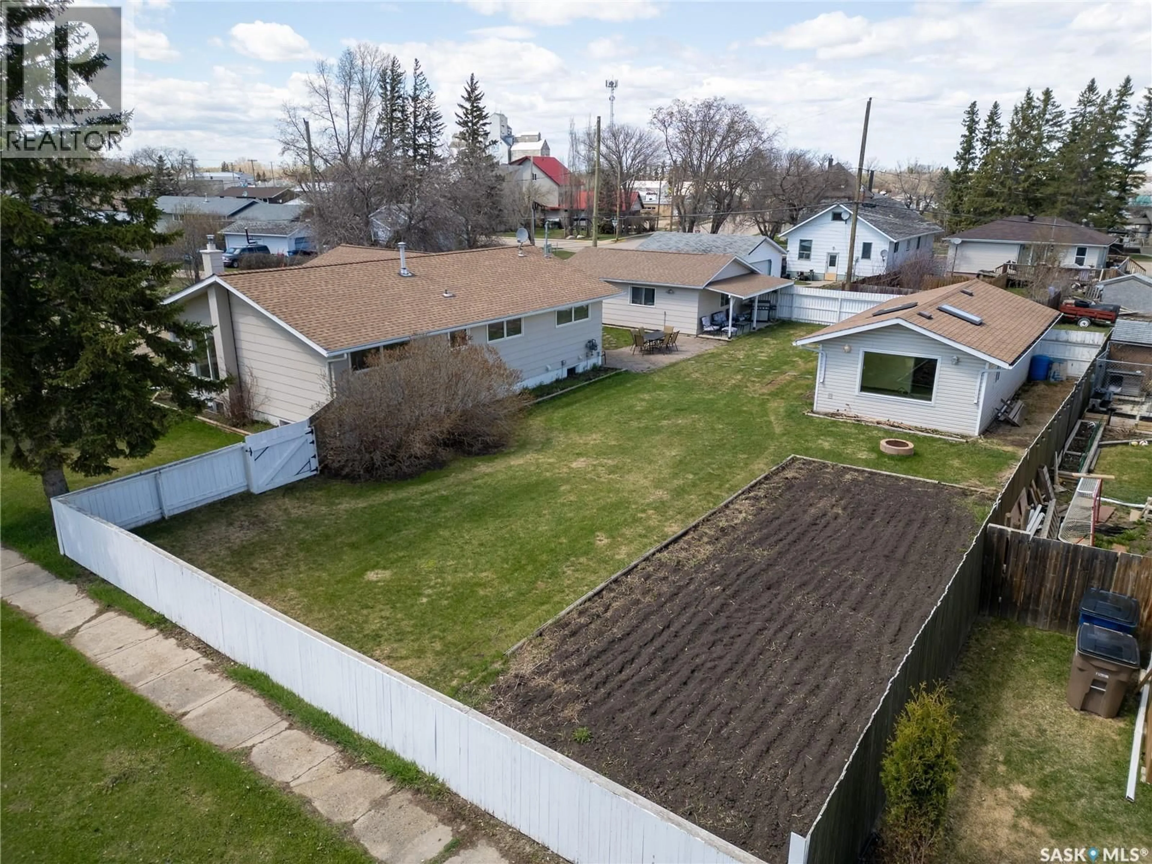 A pic from outside/outdoor area/front of a property/back of a property/a pic from drone, street for 305 STEVENS AVENUE, Birch Hills Saskatchewan S0J0G0