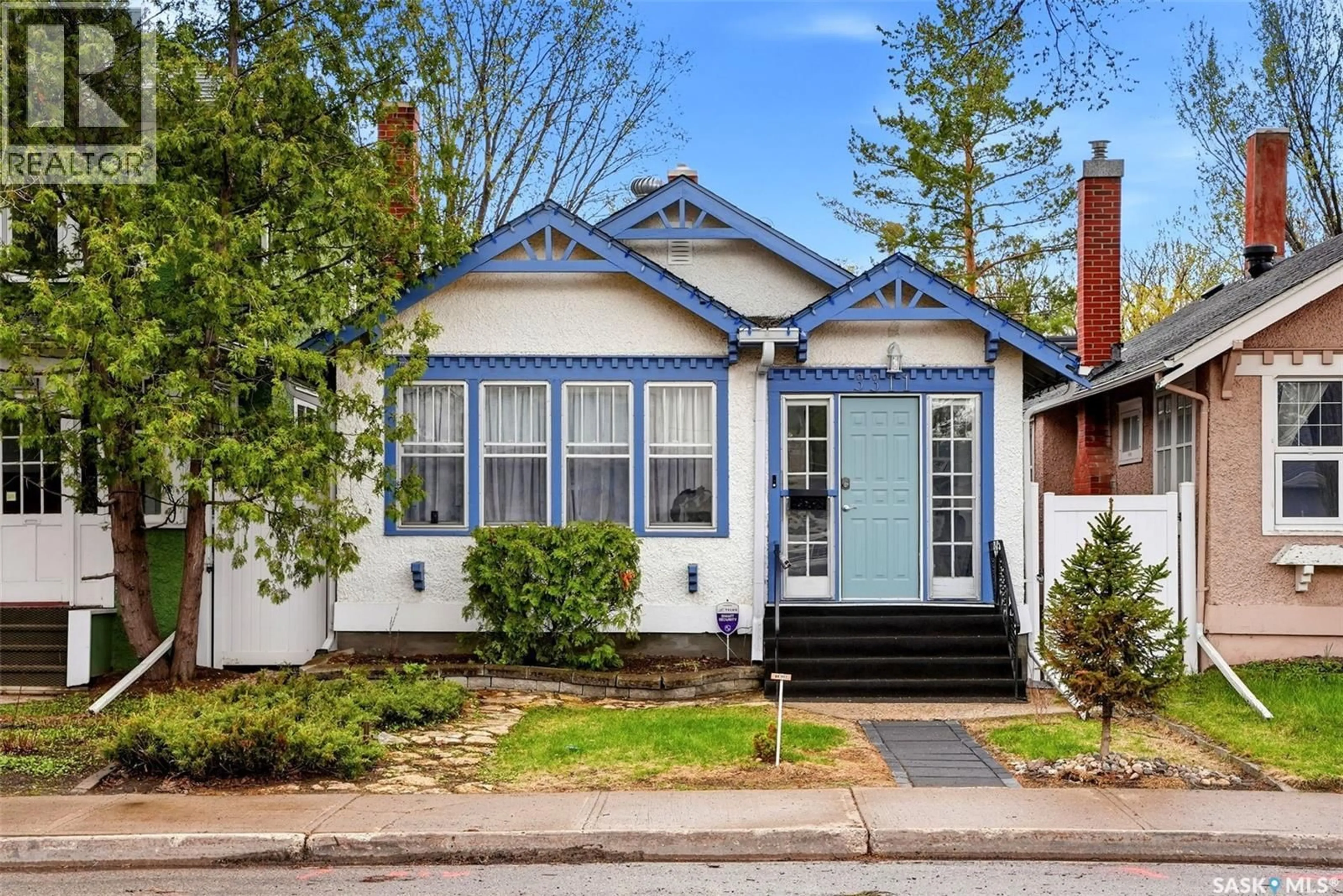 Home with vinyl exterior material, street for 3311 13TH AVENUE, Regina Saskatchewan S4T1P6