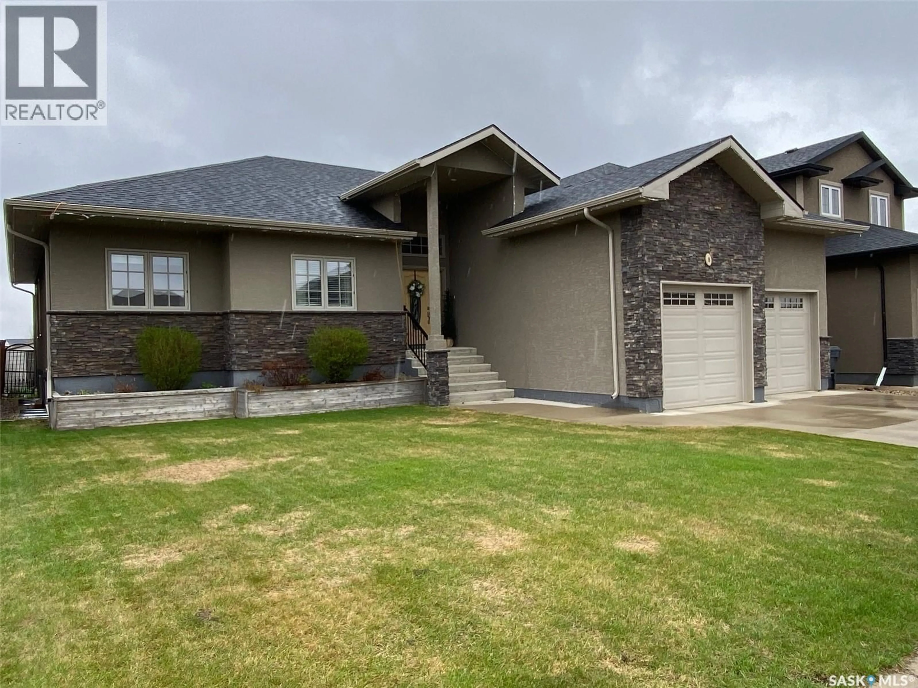 Home with vinyl exterior material, street for 8 PARTRIDGE COURT, Yorkton Saskatchewan S3N3J8