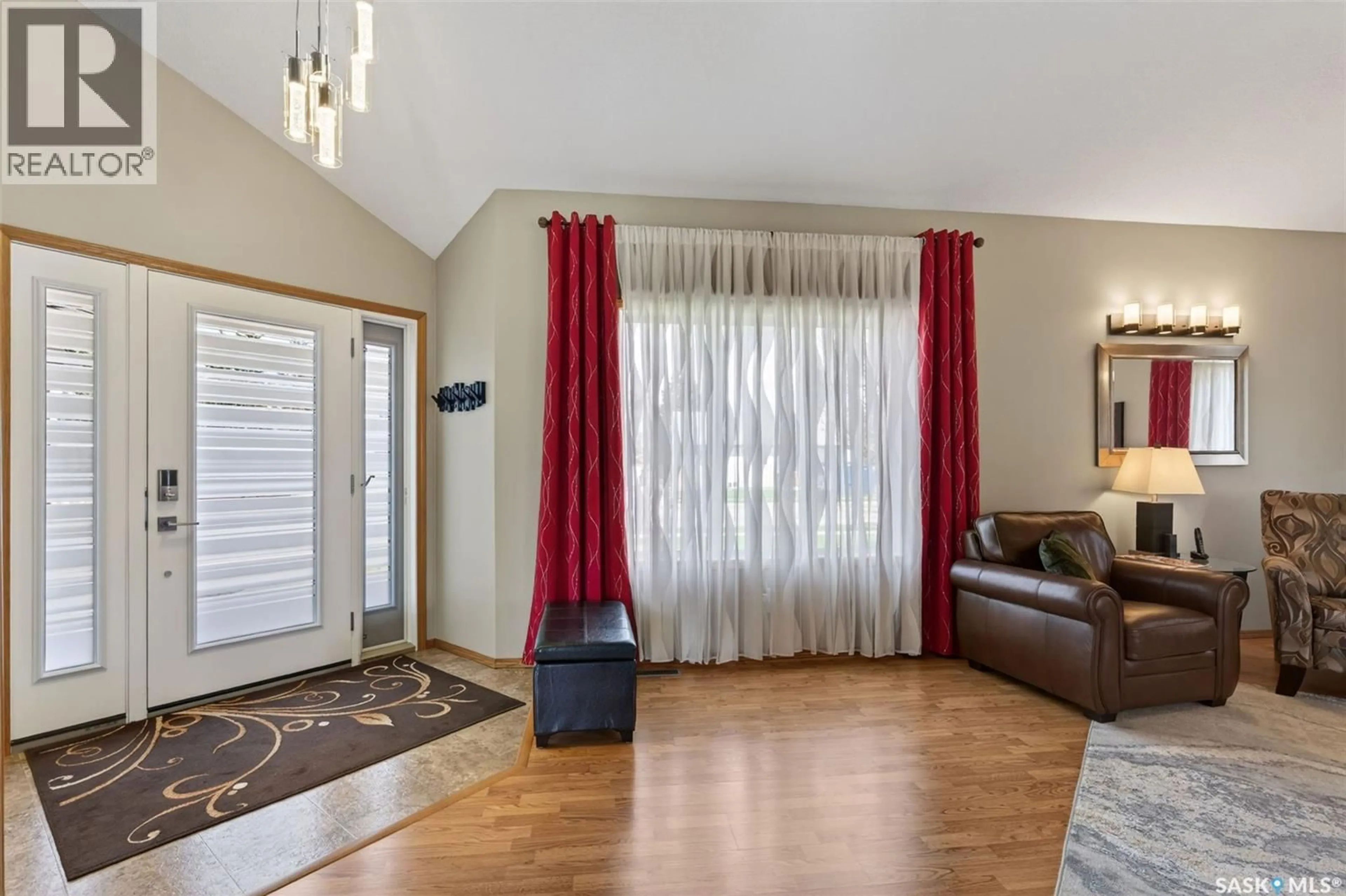 Living room with furniture, wood/laminate floor for 930 9TH STREET, Humboldt Saskatchewan S0K2A0