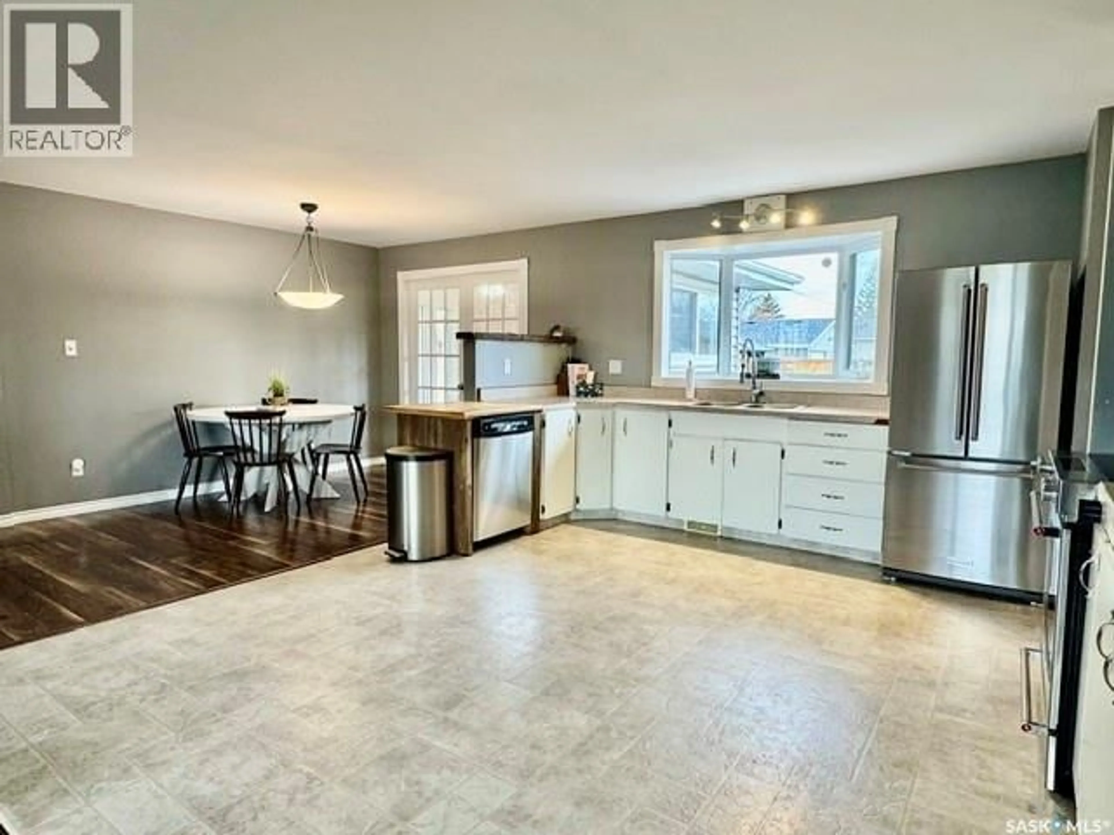 Open concept kitchen, ceramic/tile floor for 55 FOLLEY CRESCENT, Lanigan Saskatchewan S0K2M0