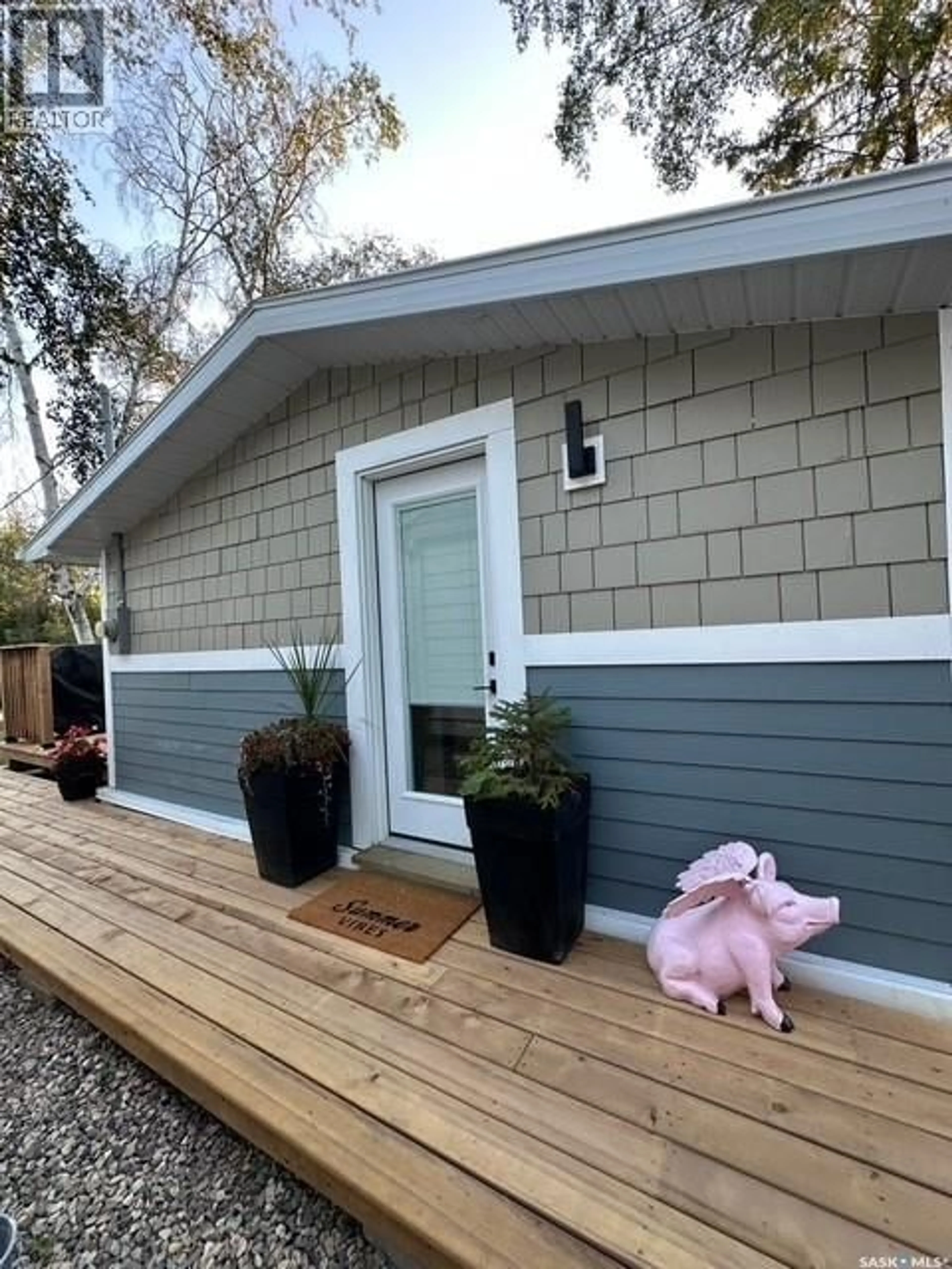 Home with vinyl exterior material, street for 34 OKADOCA STREET, Kenosee Lake Saskatchewan S0C2S0